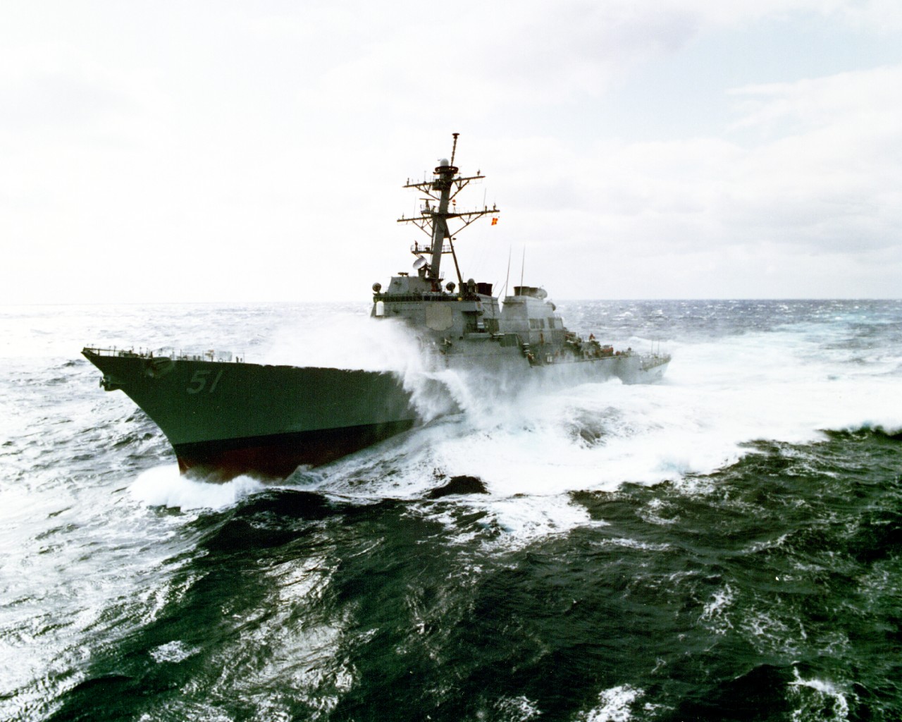 330-CFD-DN-SC-93-03708:   USS Arleigh Burke (DDG-51), 1993.   Port bow view of the guided-missile destroyer underway in rough seas in the Atlantic Ocean, March 31, 1993.  Photographed by PH3 James Collins.  Official U.S. Navy Photograph, now in the collections of the National Archives.