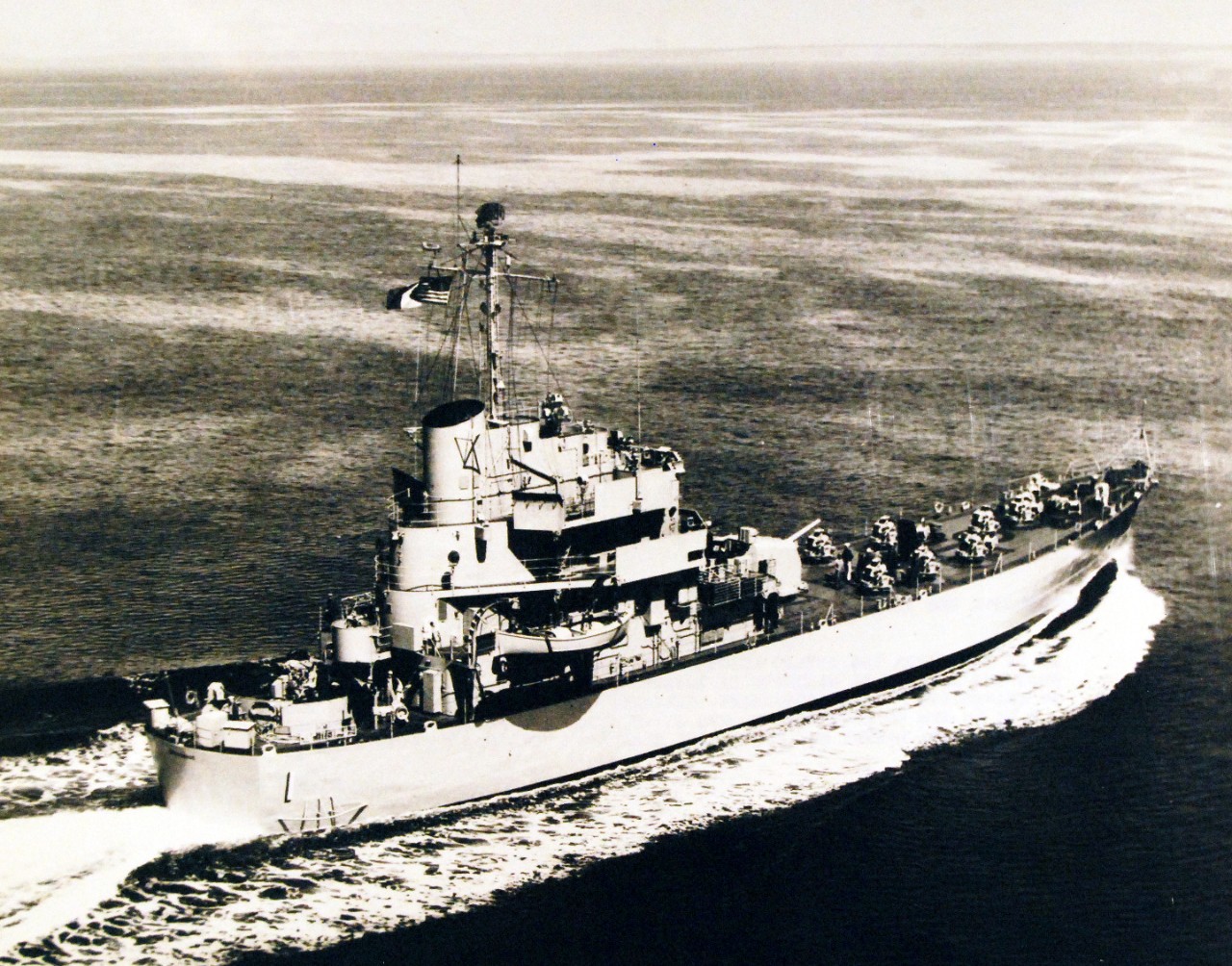 330-PS-7429 (USN 668544):  USS Carronade (IFS-1), 1955.    Carronade,  a new-type of U.S. Navy ship into which the latest improvements in shipboard habitability have been built, was commissioned on May 25 in a ceremony at the Puget Sound Naval Shipyard, Bremerton, Washington.   Designated as an inshore fire support ship, Carronade is designed to replace the LSMR (medium landing ship, rocket), which was employed during World War II to give close-in fire support to the troops ashore.   This photograph shows crew members standing by on deck as Carronade glides across the waters of Puget Sound during sea trials, May 27, 1955.   Official DOD Photograph, now in the collections of the National Archives.   (2015/02/25).  