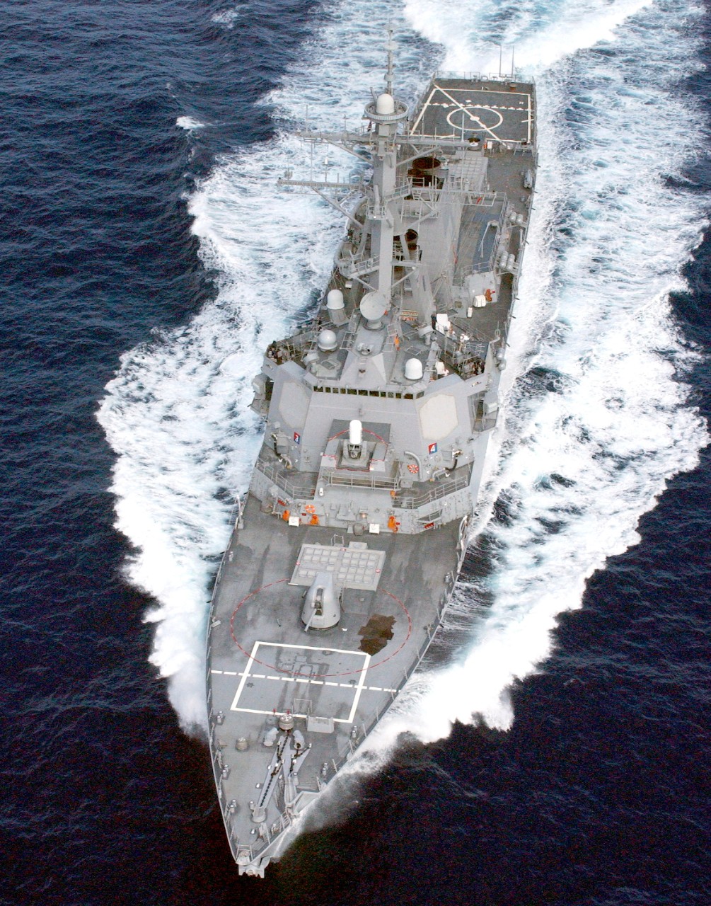 330-CFD-DN-SD-04-09221:   USS Cole (DDG-67),  2002.  Aerial oblique port bow view of the US Navy Arleigh Burke class guided missile destroyer USS Cole  (DDG-67) underway off the coast of Puerto Rico conducting Combat System Ship Qualification Trials with Naval Sea System Command, August 2, 2002.  Official U.S. Navy photograph, now in the collections of the U.S. National Archives.