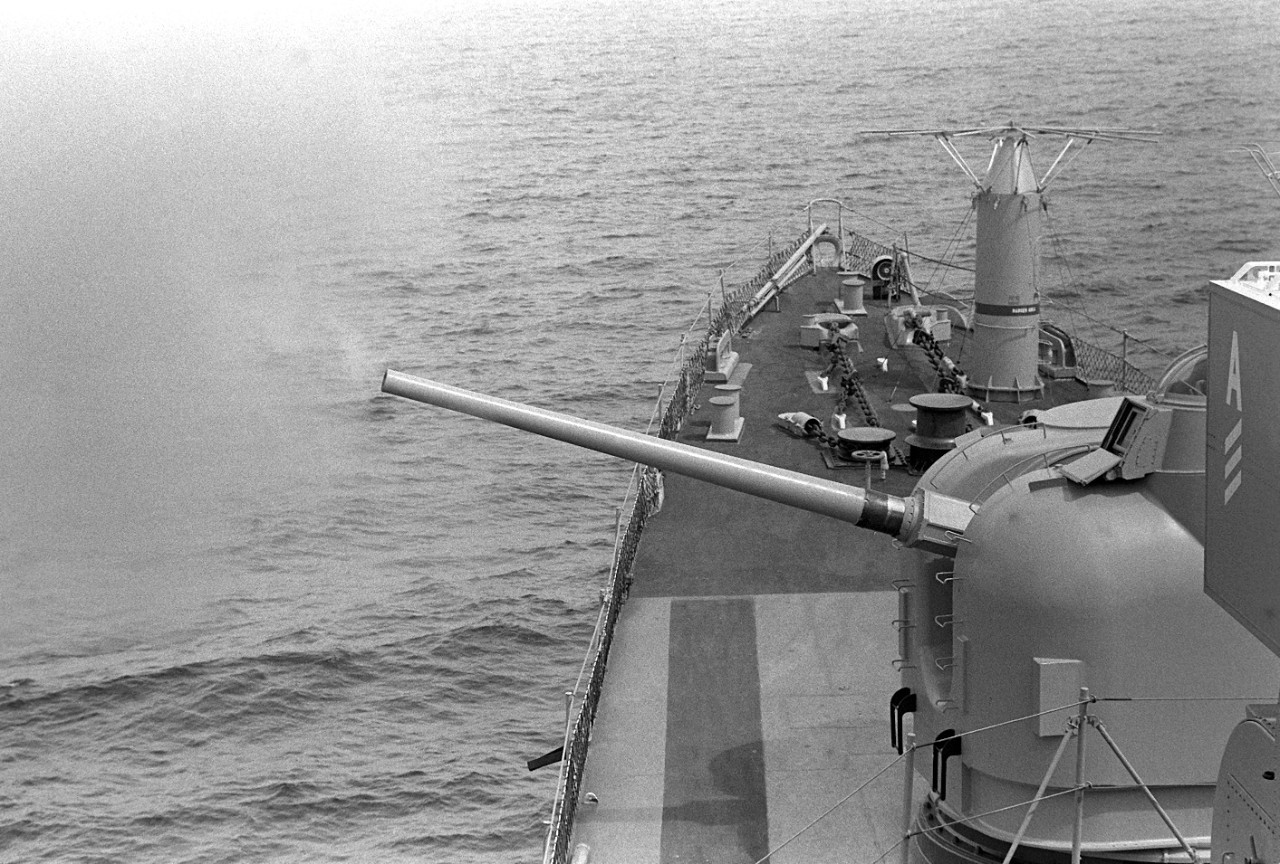 330-CFD-DN-SN-82-09482:   USS Dewey (DDG-45), 1979.     Port view of the 5-inch .54-caliber, dual-purpose, Mark 42 gun aboard the guided missile destroyer during Phase 0 of exercise Unitas XX,  June 1, 1979.    Photographed by PH2 K. Brewer.  Official U.S. Navy photograph, now in the collections of the National Archives.   