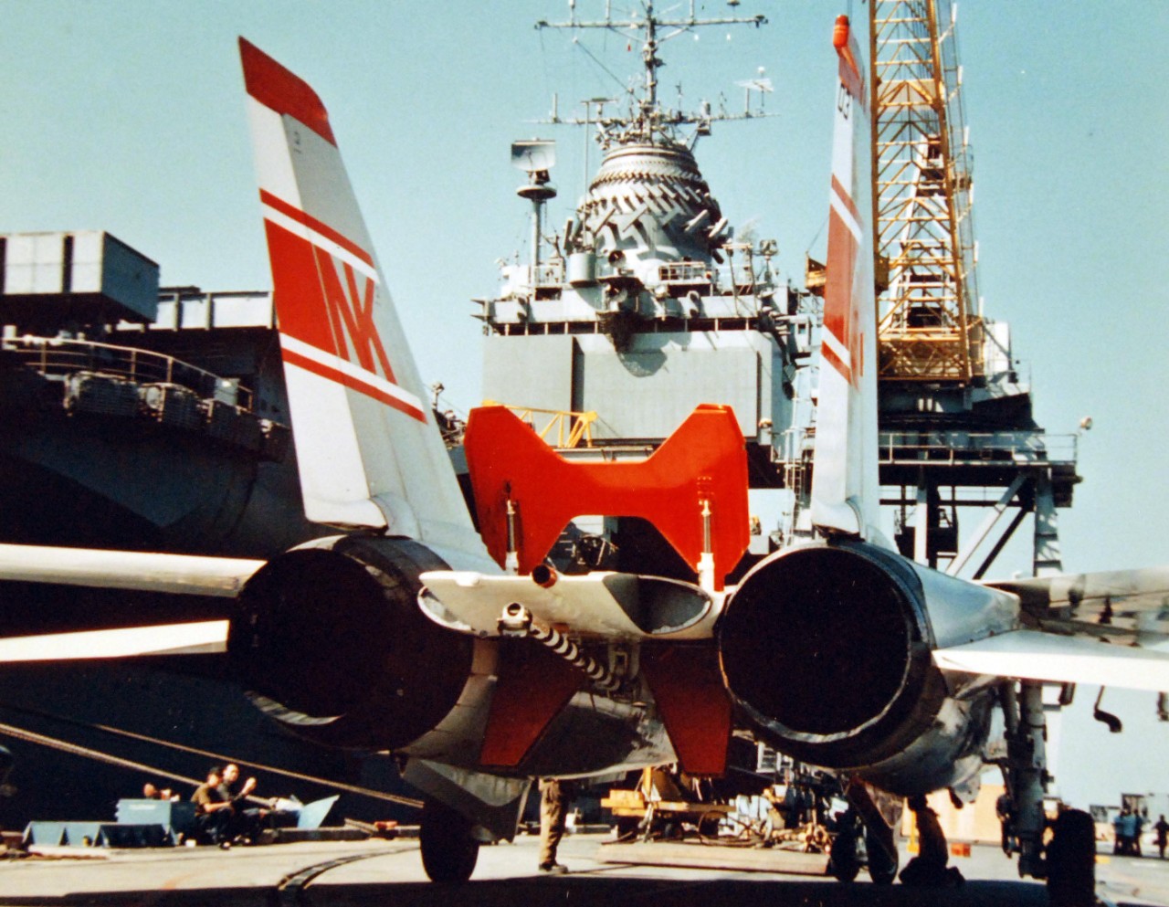 428-GX-K-105897:  USS Enterprise (CVAN-65), 1974.  View from behind a Fighter-Squadron One, VF-1, F-14A “Tomcat” fighter aircraft on a pier for loading onboard the carrier at Naval Air Station, Alameda, California.  Photographed by PH2 Paul Burns, September 14, 1974   Official U.S. Navy Photograph, now in the collections of the National Archives.  (2017/11/29).  