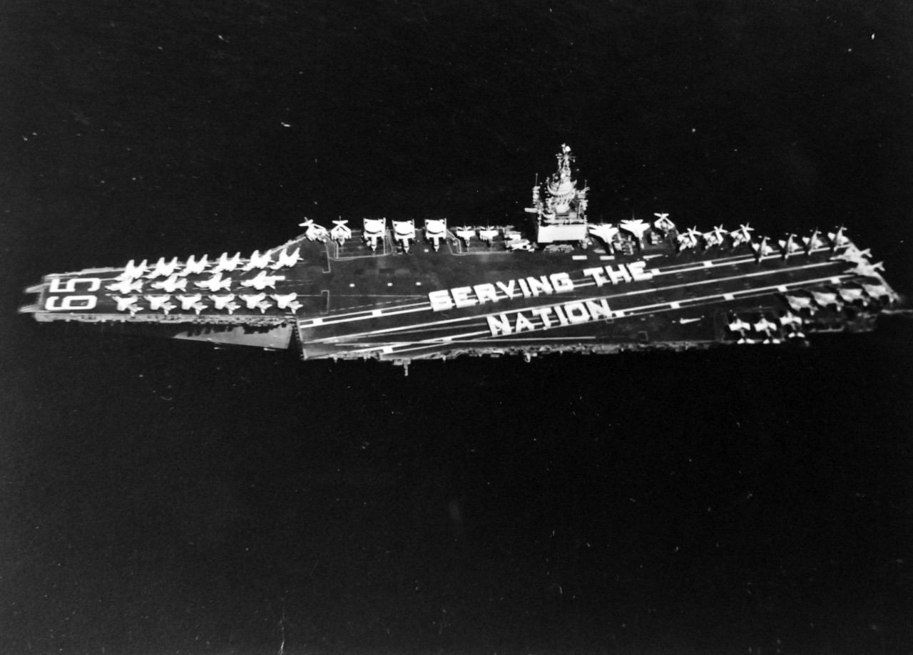 428-GX-USN-1156107:   USS Enterprise (CVAN-65), 1973.  Crew of the nuclear-powered aircraft carrier and Attack Carrier Air Wing Fourteen form the words “Serving the Nation” on the flight deck.   Photographed by PH1 Ronald C. Bartel, May 19, 1973.   Official U.S. Navy Photograph, now in the collections of the National Archives.  (2017/11/29).  
