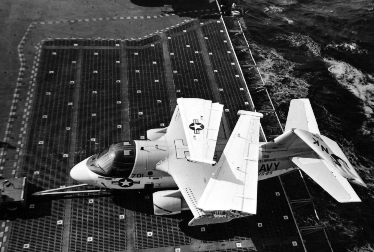 428-GX-USN-1166979:  USS Enterprise (CVN-65), 1976.   An S-3A “Viking” aircraft of Air Antisubmarine Squadron 29, VS-29, stands on the elevator of the nuclear-powered aircraft carrier during the five-nation fleet Exercise Valiant Heritage.  Photographed by PH1 Carl R. Begy, March 2, 1976.  Official U.S. Navy Photograph, now in the collections of the National Archives.  (2017/11/29).  