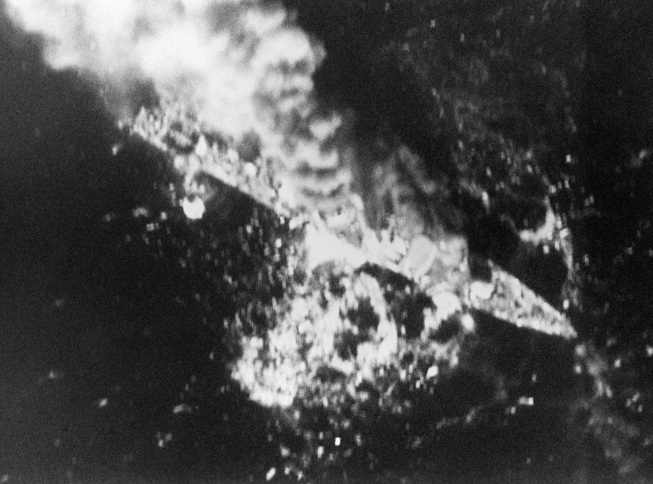 880418-N-ZZ999-005:  Operation Praying Mantis, April 1988.  Aerial view of the Iranian frigate IS Alvand (71) burning after being attacked by aircraft of Carrier Air Wing 11 from USS Enterprise (CVN-65).  The attack was launched after the guided-missile frigate USS Samuel B. Roberts (FFG-58) struck a mine on April 14, 1988.  IS Alvand was hit by three Harpoon Missiles plus cluster munitions.  Official U.S. Navy Photograph.  