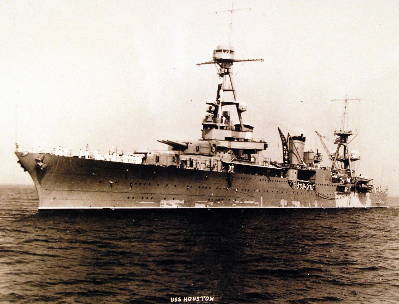 <p>19-N-13424: USS Houston (CA 30), port view while at anchor during an inspection on deck. Undated and unknown location. U.S. Bureau of Ships Photograph, now in the collections of the National Archives. (2015/2/3).</p>
