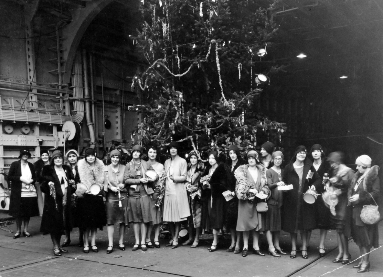 80-CF-837-(Box 173)-Lexington:   USS Lexington (CV 2), December 1929.  Wives of the Lexington’s Officers and members of the Tacoma charity organizations decorating the Christmas tree, 24 December 1929.   Official U.S. Navy Photograph, now in the collections of the National Archives.   (2014/9/30). 