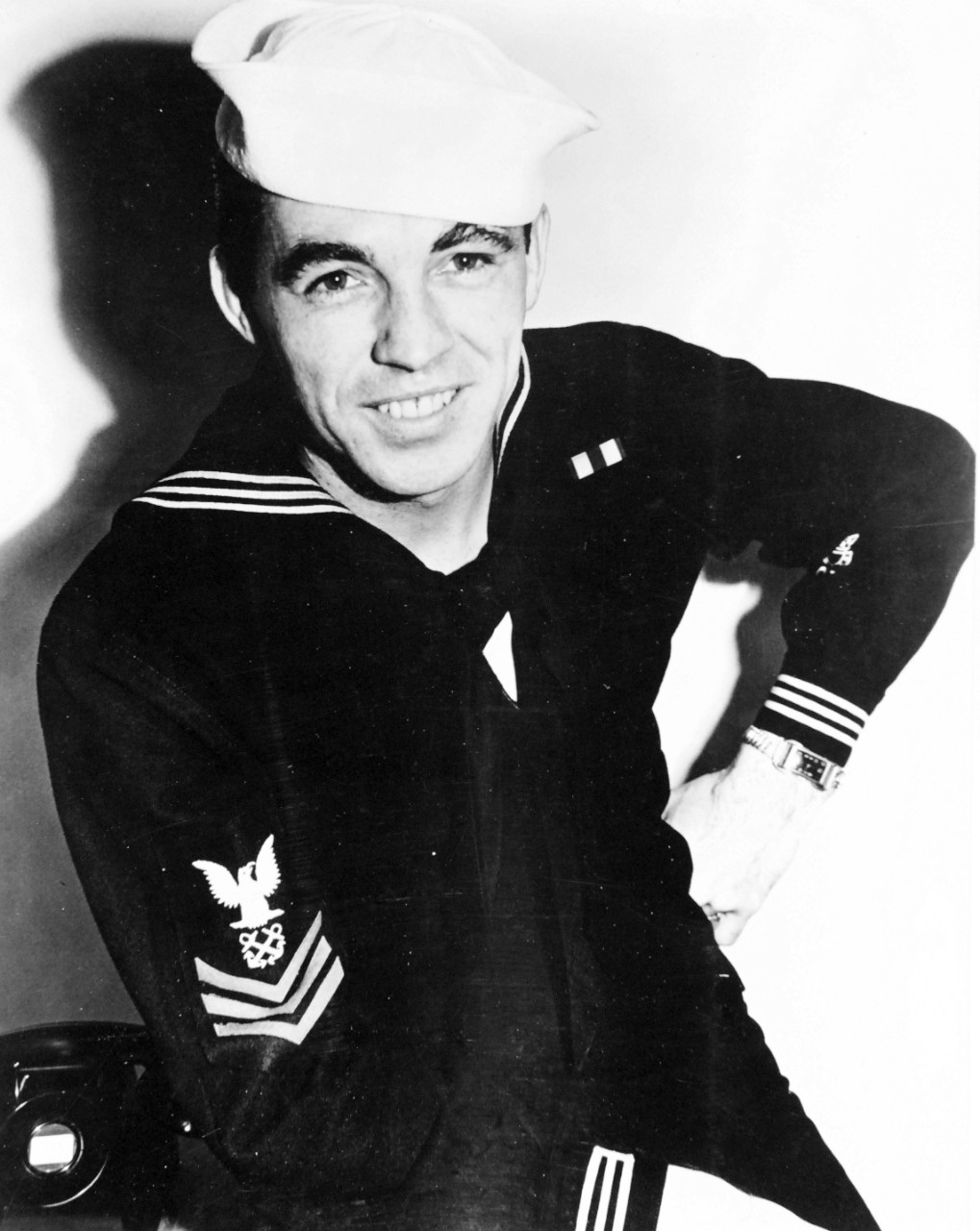 80-G-207669:  Opeartion Galvanic, November 1943.   Boatswain’s Mate First Class A.F. Wigle, survivor from USS Liscome Bay (CVE-56), November 24, 1943.  Photographed January 5, 1944.     Official U.S. Navy Photograph, now in the collections of the National Archives.  (2017/06/27).