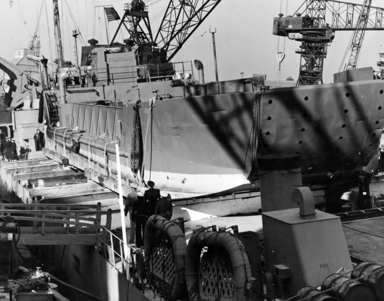 80-G-36267:  USS LST-383, December 1942.  Launching of LCT-401 over the side of USS LST-383 at Norfolk, Virginia, December 3, 1942.  LCT is being loaded on the LST.     Official U.S. Navy Photograph, now in the collections of the National Archives.  (2017/11/22).  
