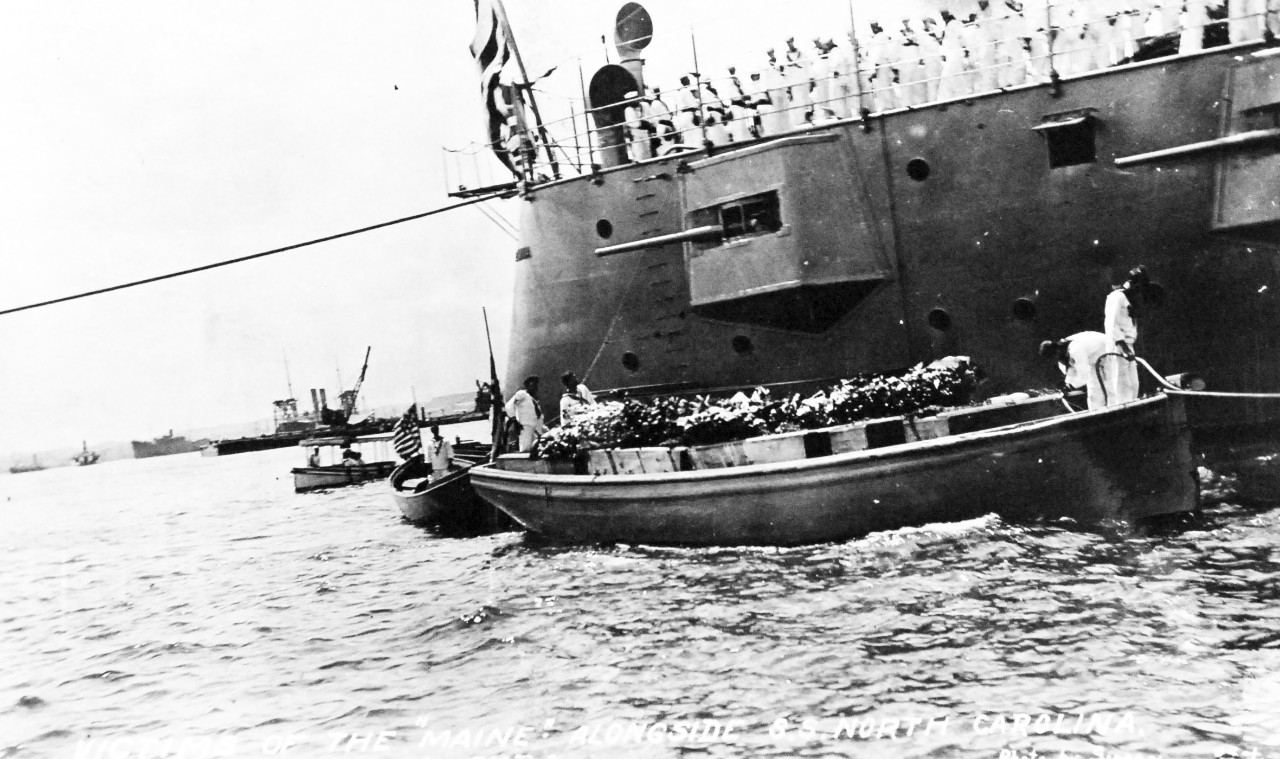 80-G-680182:  USS Maine (1895-98), March 1912. Remains of USS Maine sailors being brought to USS North Carolina  (Armored Cruiser #12),  , March 1912, received 14 September 1955.  Official U.S. Navy Photograph, now in the collections of the National Archives. (2014/04/03).    