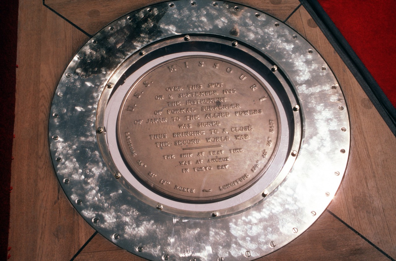 300-CFD-DN-ST-86-07094:  USS Missouri (BB-63), 1986.   The plaque aboard the battleship USS Missouri (BB-63) marking the spot where the treaty ending World War II was signed.  Official U.S. Navy Photograph, now in the collections of the U.S. National Archives - Online Public Access.