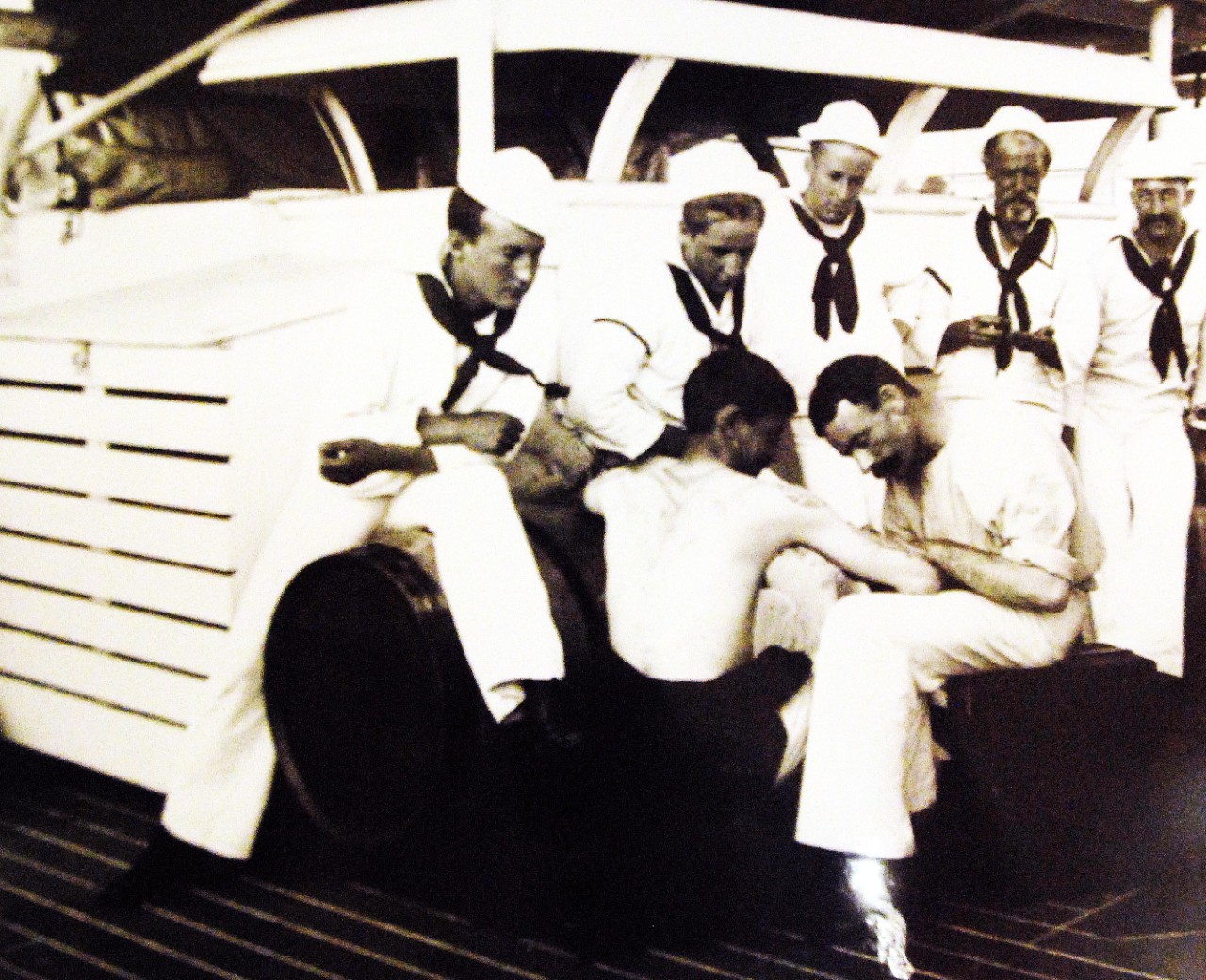 LC-J698-61328: USS Olympia (Cruiser #6), 1899.   Tattooing, circa 1899.  Photograph by Francis B. Johnston.  Courtesy of the Library of Congress, Lot 8688.    (2015/5/15).