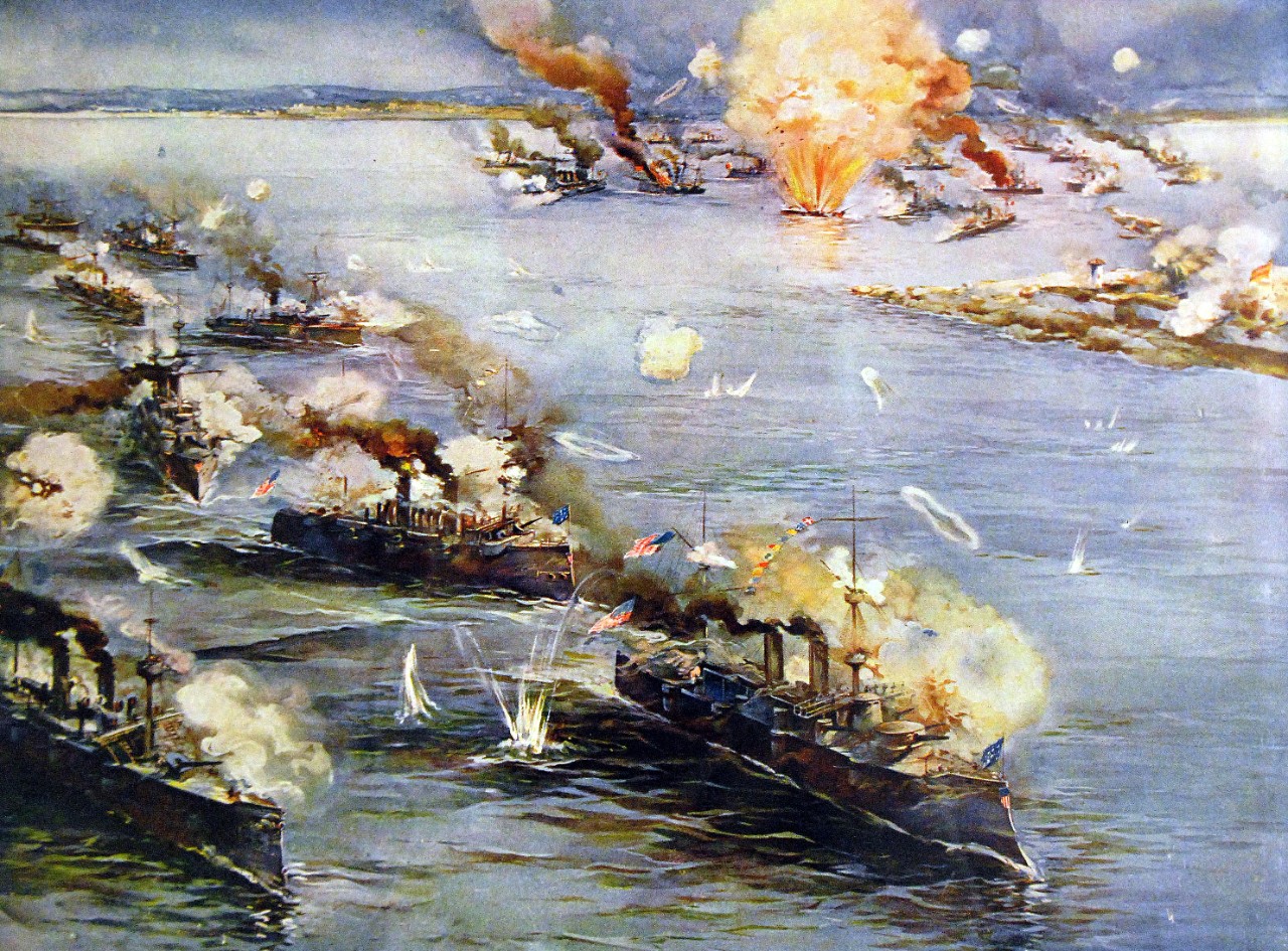 LC-Lot-4235:  Spanish American War:   Battle of Manila Bay, May 1, 1898.    With Manila, Philippines, in the top center, and the Spanish fleet in the upper right, the U.S. Navy ships listed descending on the left to bottom are:   Colliers; USS McCullough; USS Petrel; USS Concord; USS Boston;  USS Raleigh; USS Baltimore; and USS Olympia – signaling “Remember the Maine.”  Color lithograph by Rand McNally.  Courtesy of the Library of Congress.  (2015/5/8).  