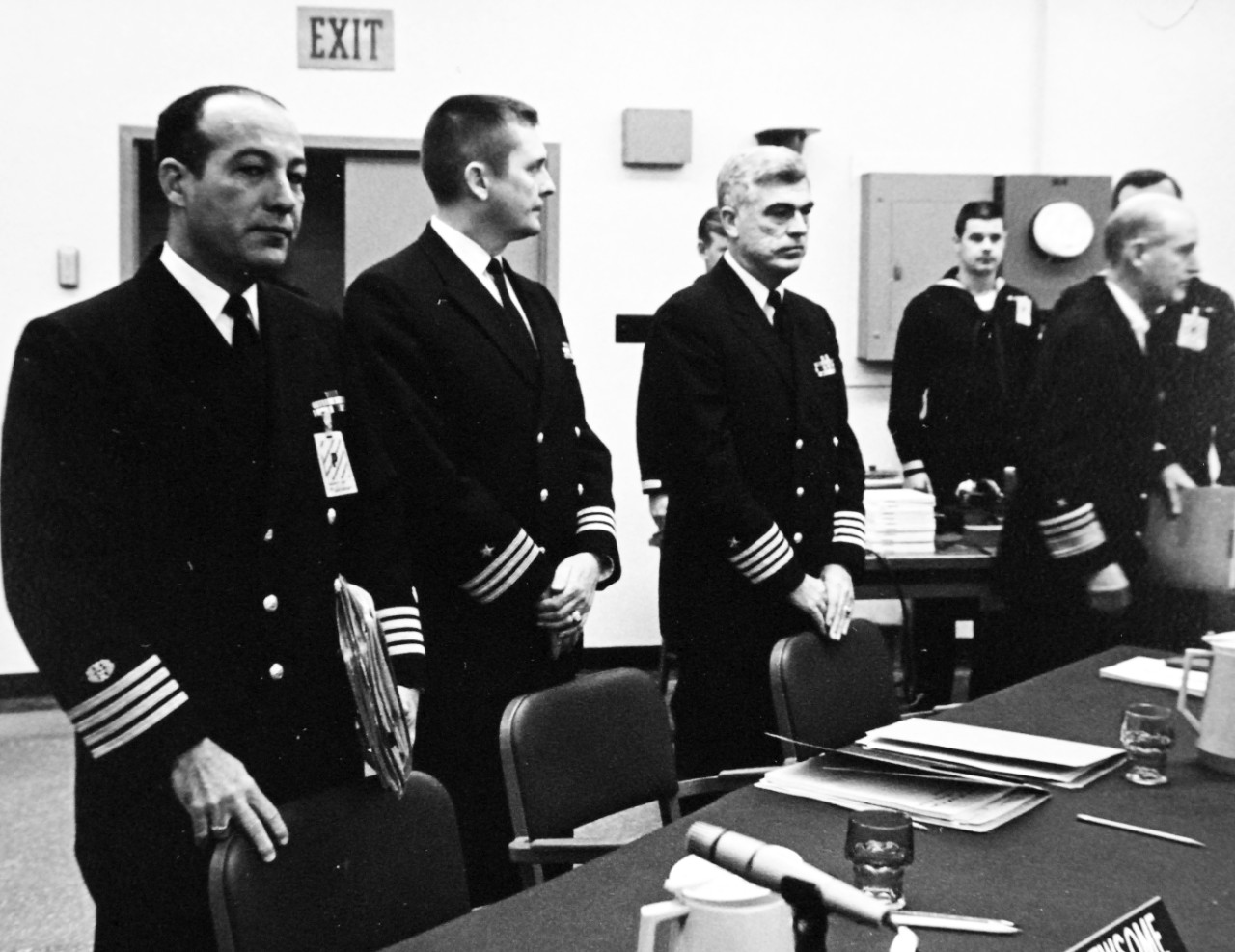 428-GX-USN-1140165:  U.S. Naval Station, San Diego, January 24, 1969.  Naval Officers prepare for closed session of the Court of Inquiry on the capture of the USS Pueblo (AGER-2).  From left, Captain William R. Newsome, Counsel for the Court; Commander Richard W. Bates; Captain Roger M. Barr, Representative of the Navy Department, Washington, D.C.; and Vice Admiral Harold G. Bowen, Jr., President of the Court.   Photographed by AN Nord Petersen.  Official U.S. Navy Photograph, now in the collections of the National Archives (2017/05/23).  Photographed from reference card. 