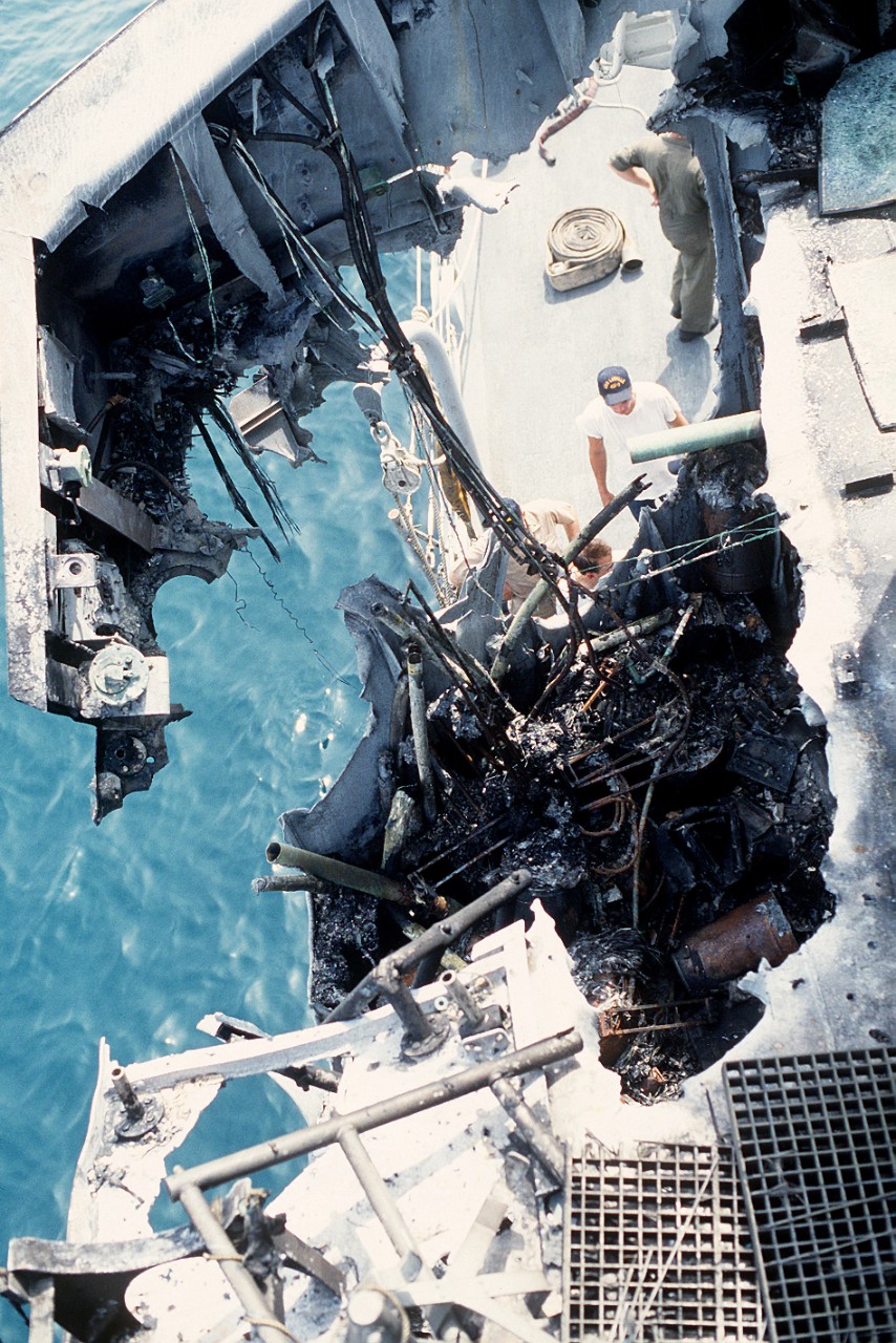 330-CFD-DN-ST-87-06419:  USS Stark (FFG-31), 1988.   A close-up view of damage to the guided missile frigate USS Stark (FFG-31) after it was struck by an Iraqi-launched Exocet missile.   U.S. Navy Photograph, now in the collections of the U.S. National Archives.