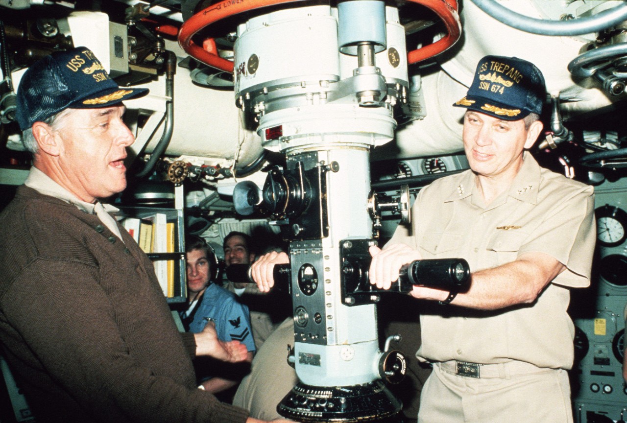 330-CFD-DN-ST-87-02289:  USS Trepang (SSN-674), 1985.  Admiral James D. Watkins, chief of naval operations, left, and Vice Admiral N.R. Thunman, deputy chief of naval operations, submarine USS Trepang (SSN-674) while inspecting the Arctic Research and Environmental Acoustic (AREA) program. AREA '85 is a Navy-sponsored expedition to study oceanography, acoustics, geophysics, communications and submarine warfare in the polar environment, July 5, 1985. Photographed by JOC Fred J. Klinkenberger, USN.  U.S. Navy photograph, now in the collections of the National Archives.  