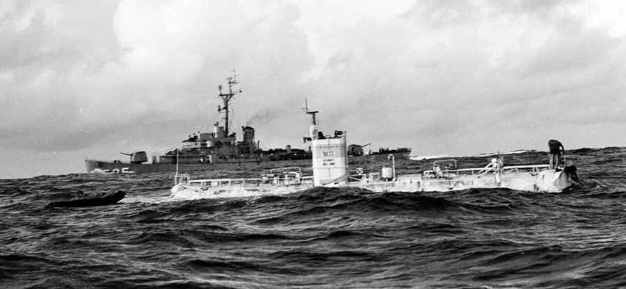 NH 96797:  U.S. Navy Bathyscaphe Trieste just before her record dive to the bottom of the Marianas Trench, January 23, 1960. USS Lewis (DE-535) is in the background.   NHHC Photograph Collection