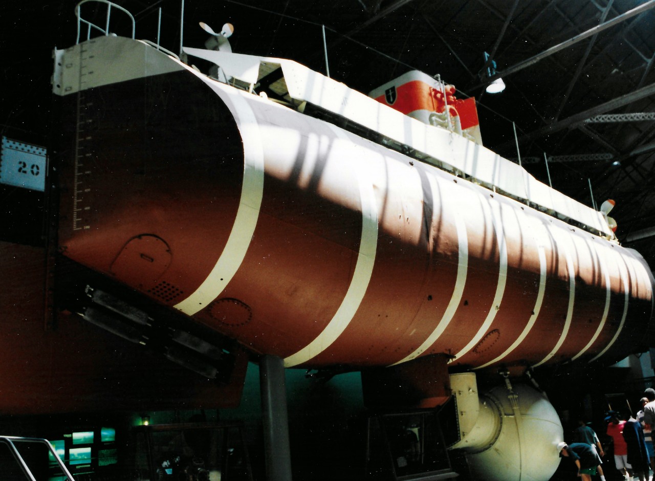 NMUSN-1026 (Color):    Bathyscaph Trieste, late 1990s.   View of bathyscaph on display.  Note the exhibit work space wall hasn’t been constructed yet.   National Museum of the U.S. Navy Photograph Collection.  