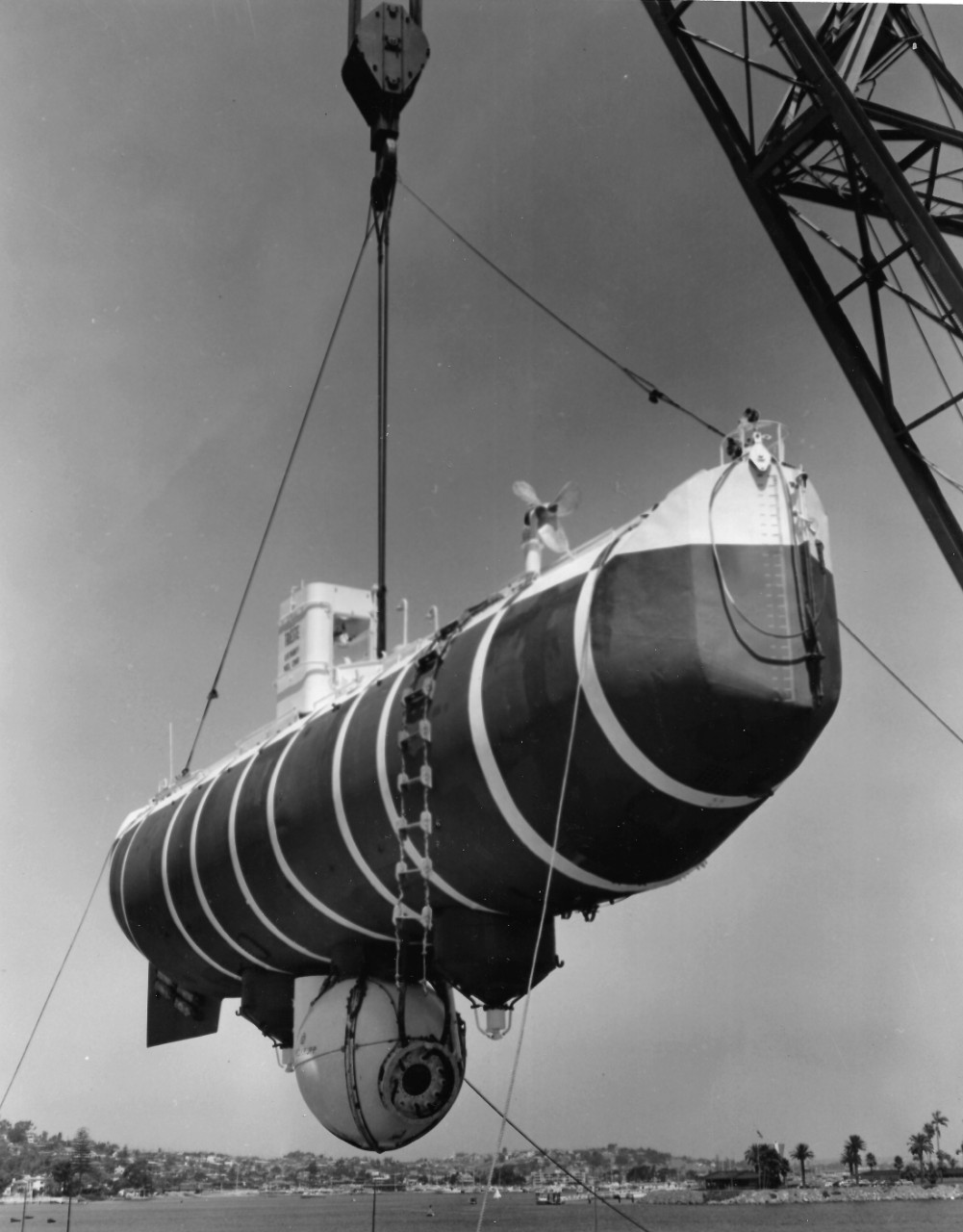 NMUSN-4624:  Bathyscaph Trieste, 1959.   Is hoisted by a floating crane, possibly during testing by the Naval Electronics Laboratory in San Diego, California.    National Museum of the U.S. Navy Photograph Collection. 