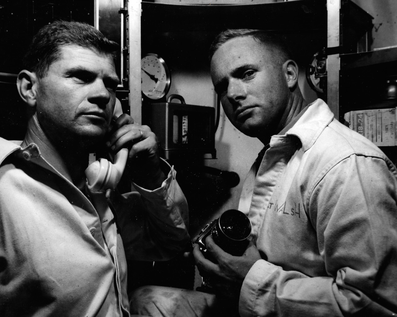 NMUSN-4638:   Bathyscaph Trieste, 1960.   Lieutenant Don Walsh, right, and Dr. A.B. Rechnitzer, possibly during testing by the Naval Electronics Laboratory in San Diego, California.    National Museum of the U.S. Navy Photograph Collection.