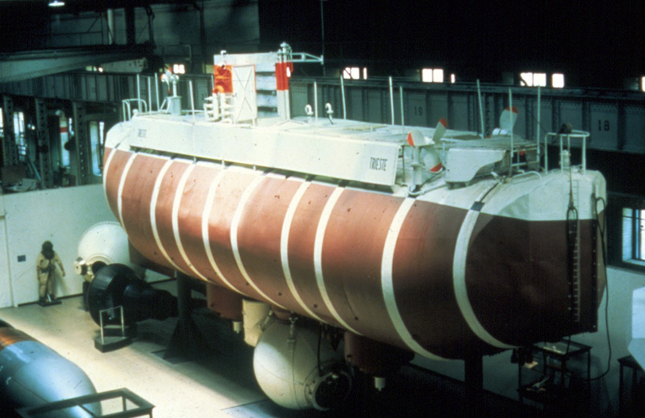 NMUSN-5181 (Color):    Bathyscaph Trieste, possibly 1979-1981.    Trieste on display at the Navy Memorial Museum (now National Museum of the U.S. Navy).   Note the back wall construction hasn’t been done yet, and the Undersea Exploration exhibit area was not designed yet.   National Museum of the U.S. Navy Photograph Collection.  