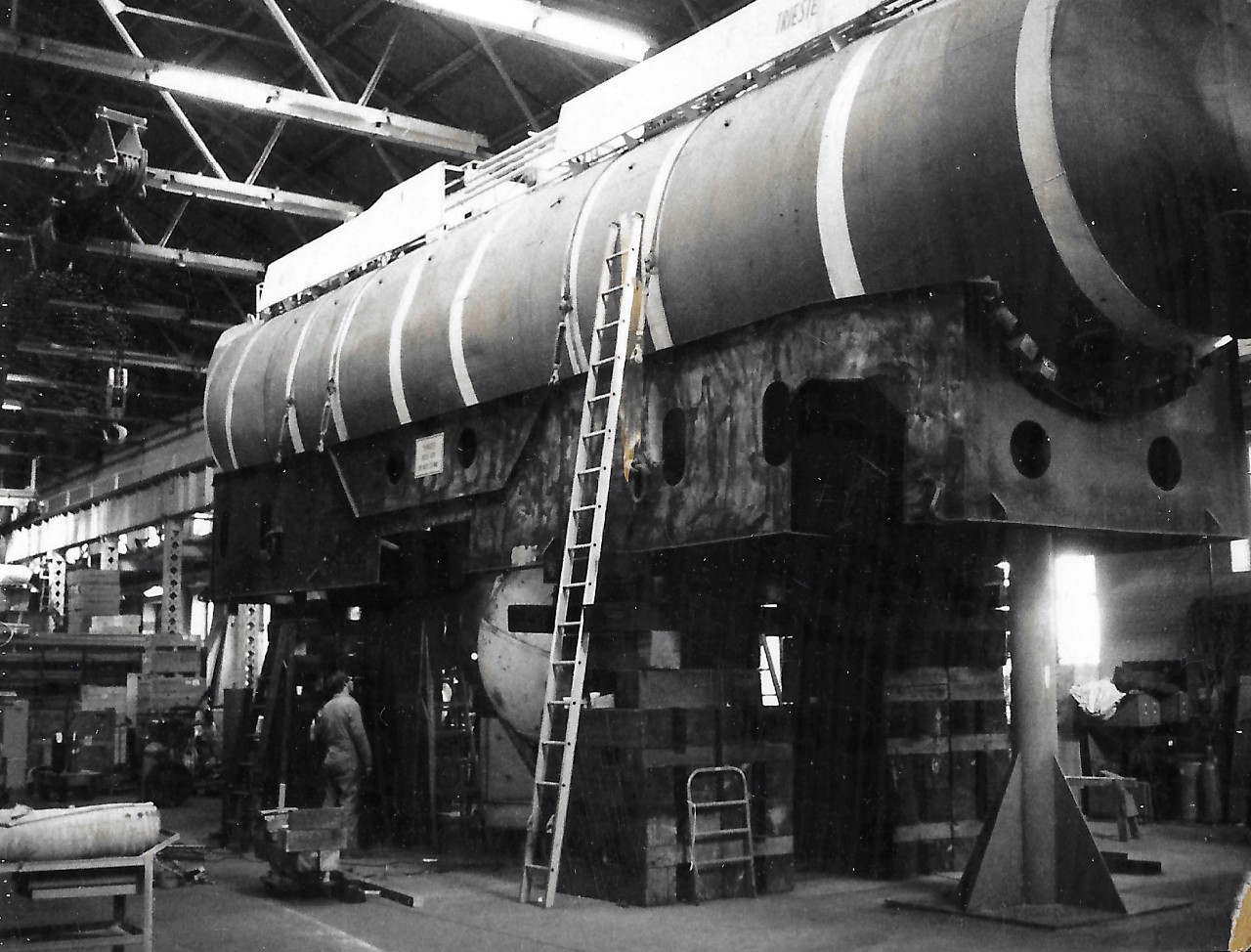 NMUSN-626:   Bathyscaph Trieste, 1976-1977.    Trieste being installed at the Navy Memorial Museum, not National Museum of the U.S. Navy.    Note the bathyscaph is still in her cradle at this point.    National Museum of the U.S. Navy Photograph Collection.  