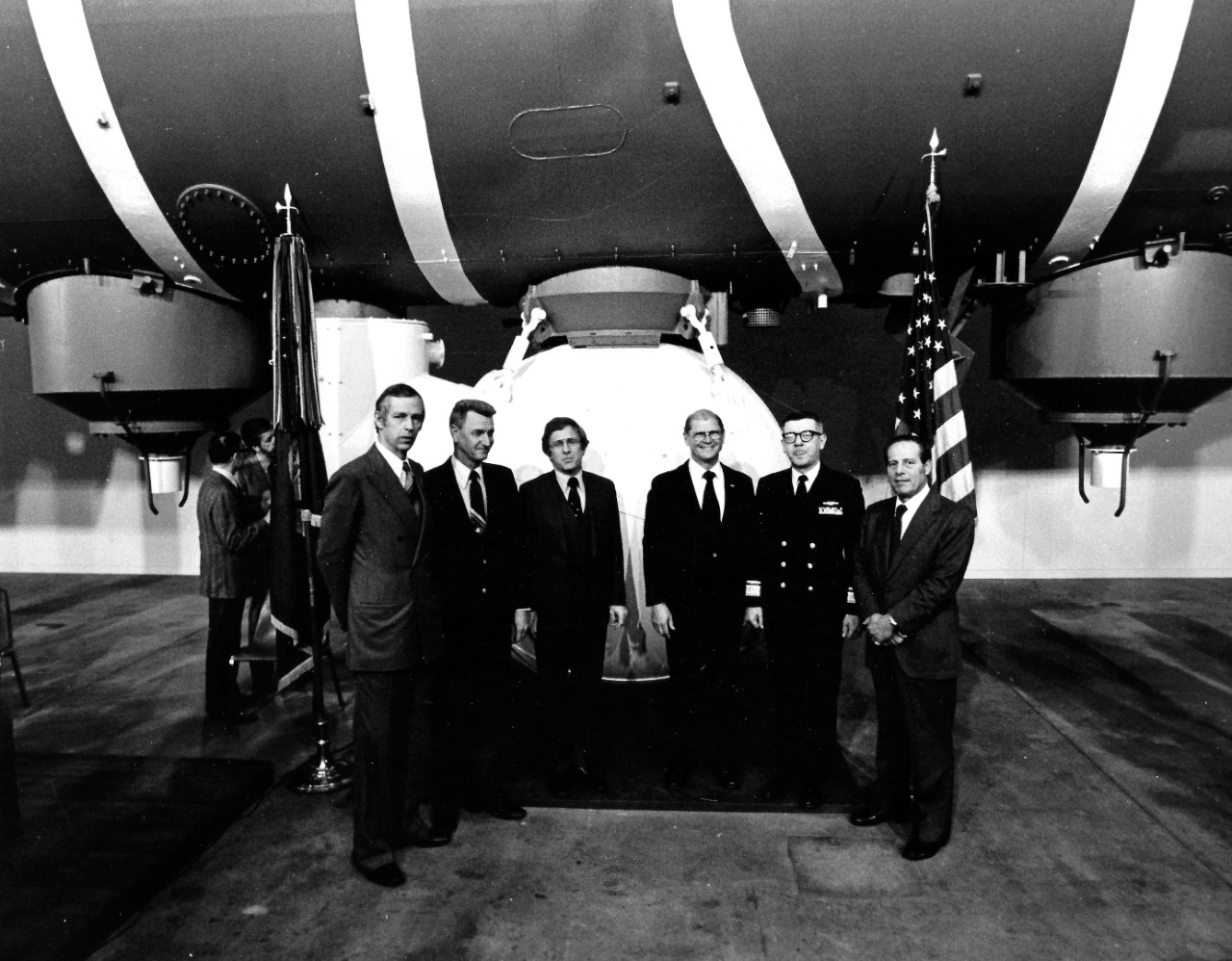 NMUSN-630:  Bathyscaph Trieste, 1977.   Opening ceremony of the Trieste display.    Shown on far left is Jacques Piccard and third from left is Lieutenant Don Walsh.   The two men were the first men to descend and explore the Marianas Trench in January 1960.    National Museum of the U.S. Navy Photograph Collection.  