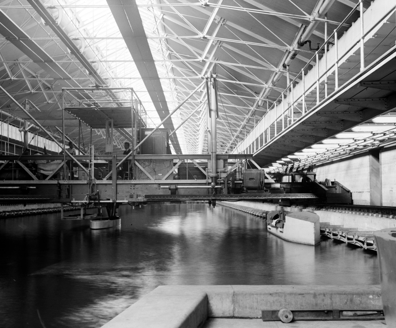 LC-DIG-NPCC-00824:  Experimental Model Basin, Washington Navy Yard, 1918.   Note man on platform.  The Model Basin is now the Cold War Gallery of the National Museum of the U.S. Navy.   Courtesy of the Library of Congress.  