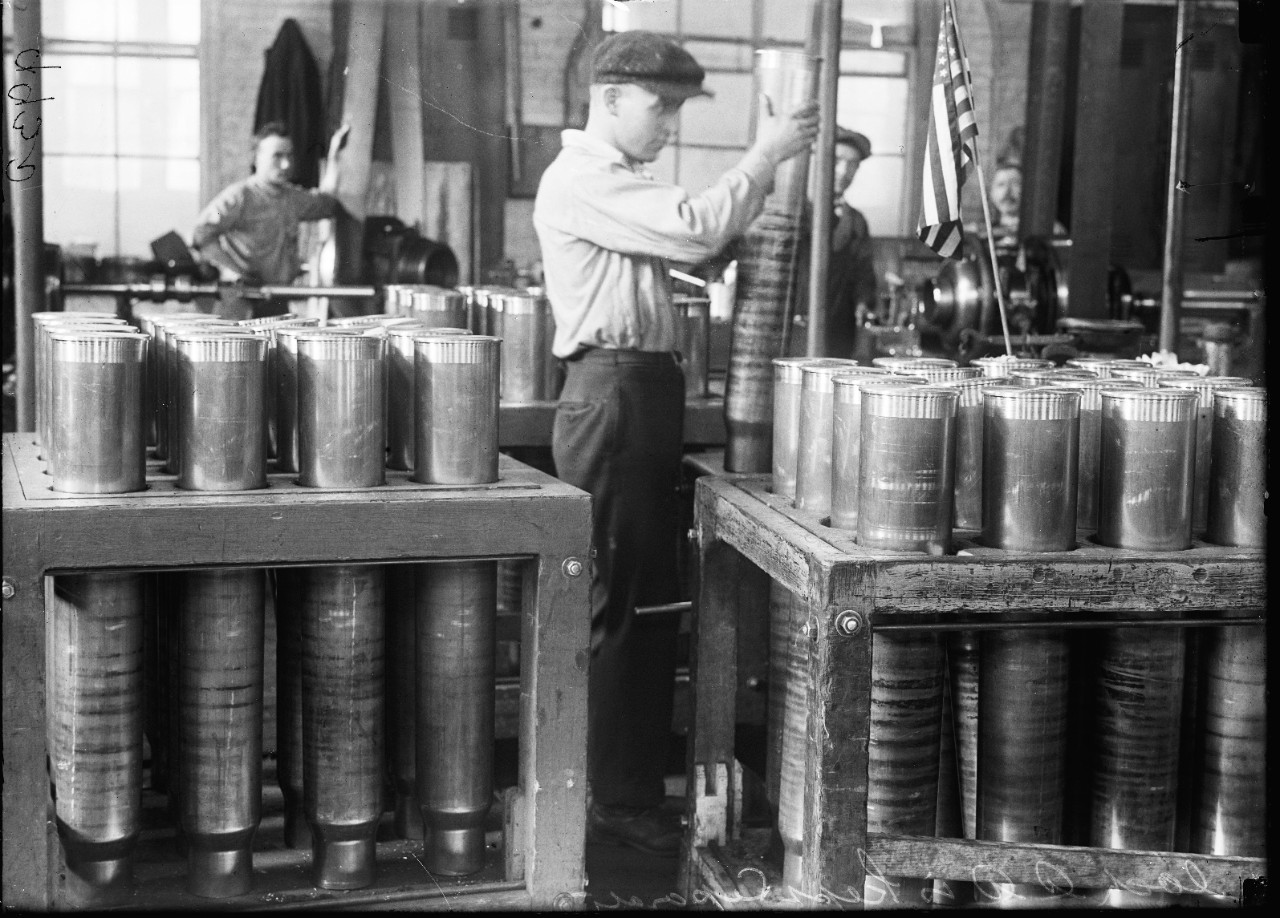 LC-DIG-HEC-10054:   U.S. Naval Gun Factory, Washington Navy Yard, 1917.  Employees pack and handle cartridge cases.  Photographed by Harris & Ewing, 1917.  Courtesy of the Library of Congress.   