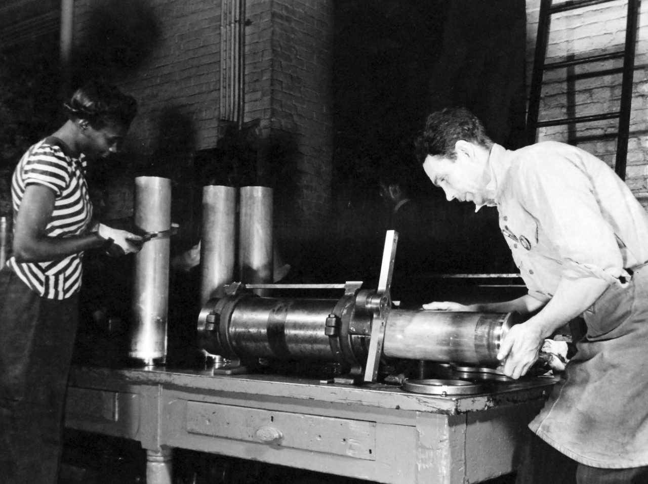 80-G-38502:  U.S. Naval Gun Factory, Washington Navy Yard, 1943.   Shown:  Checking body dimensions on 5” cartridge cases.  Photograph released March 20, 1943.   Official U.S. Navy photograph, now in the collections of the National Archives.  