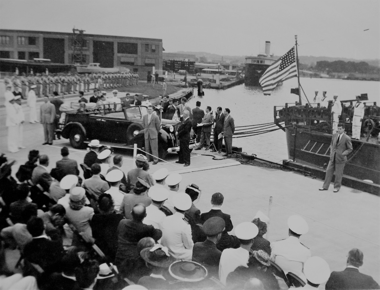 LC-Lot-4263-48:   Greek Ambassador Visit, Washington Navy Yard, 1943.   Secretary of the Navy Frank Knox at the Washington Navy Yard, Washington, D.C., June 10, 1943.   The ceremony detailed the  presentation of a patrol boat to the Greek Government.  President Franklin D. Roosevelt and Greek Ambassador Cimon Diamantopoulous watch from the rear seat of their automobile as the American flag is about to be hauled down.  Secretary of the Navy Frank Knox Collection.   Courtesy of the Library of Congress.  