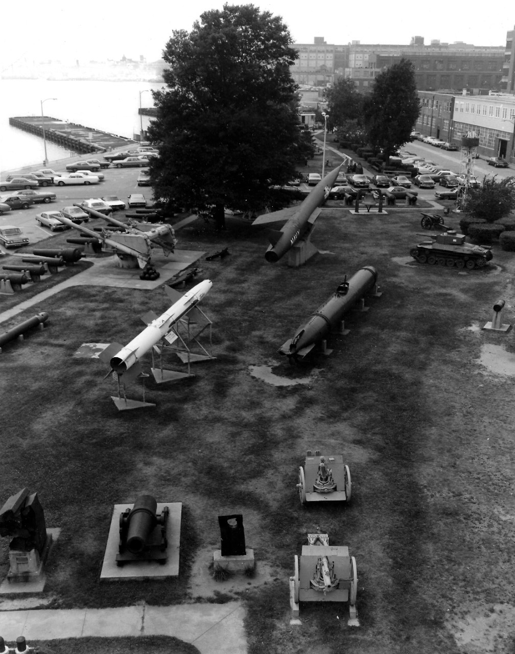 NMUSN-150:  Willard Park, Washington Navy Yard, Washington D.C. 1970s.   View looking west.     Top section (left to right):  Talos missile, Terrier Missile;  surface to air missiles and launcher; Regulus II missile; Japanese two-man submarine; Type 97 Medium Tank (Chi-Ha) (Japan); 16” gun.    Back:  High altitude probe launching system.   Front:  Armor plating; 12” gun and crib; 6” armor plate; and 3” MKIV guns.    National Museum of the U.S. Navy Photograph Collection.  