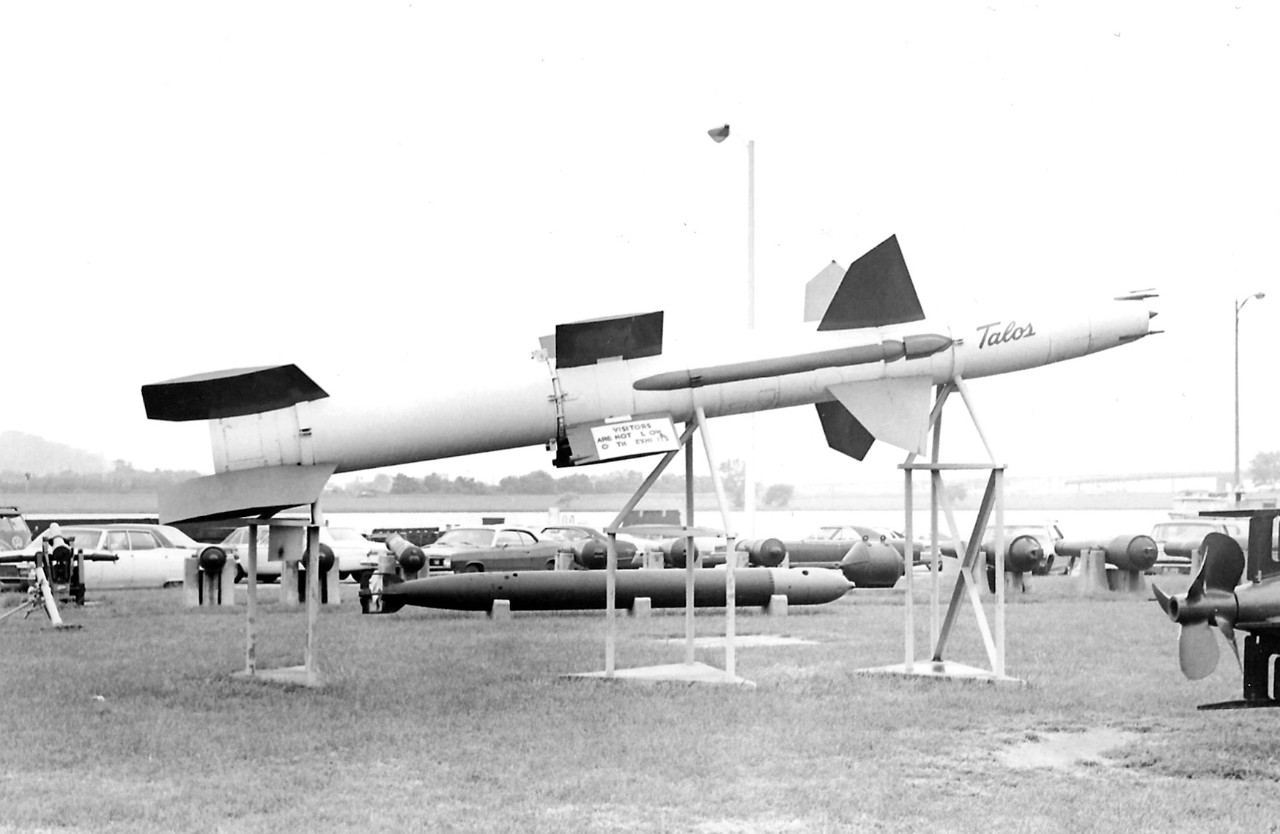 NMUSN-157:   Willard Park, Washington Navy Yard, Washington, D.C. 1970s.   View looking south.   Talos Missile is in the center with WWII-era German torpedoes underneath.    National Museum of the U.S. Navy Photograph Collection. 