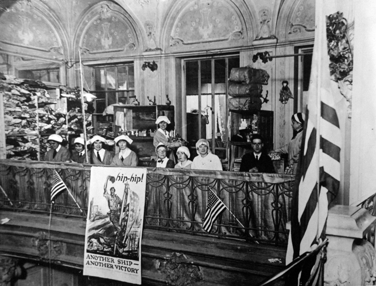 <p>165-WGZ-2L-10: Stock Room and workers pictured at the American Fund for French Wounded, Paris Depot, located at Alcazar d’Ete, Champs-Elysees, 1918. Note the recruiting poster at bottom left. U.S. War Department photograph, now in the collections of the National Archives. (2014/8/27).</p>
