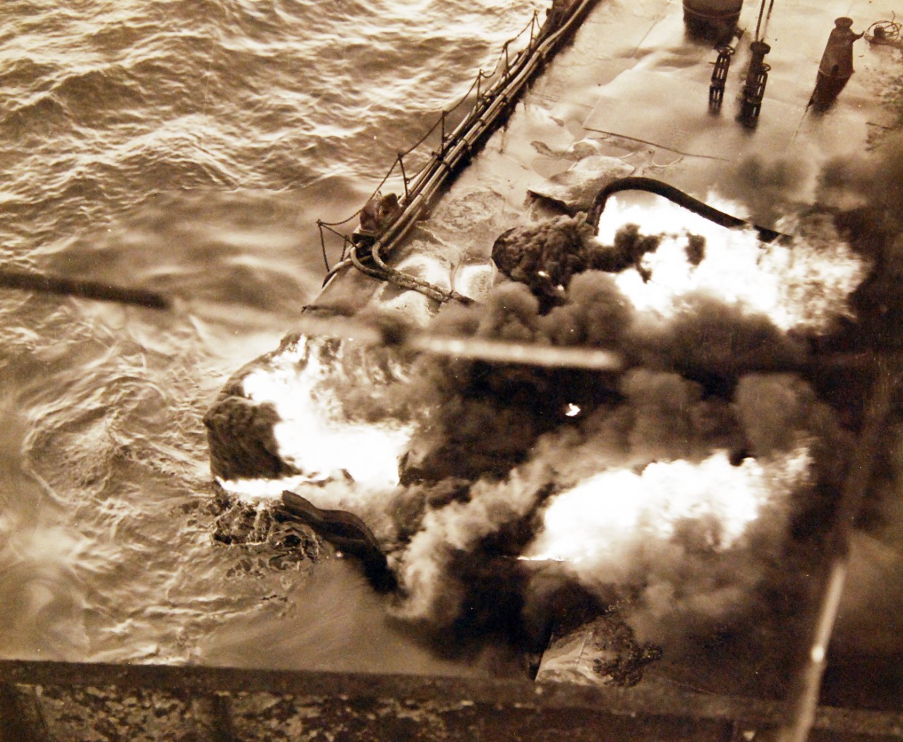 <p>80-G-61575: German U-boat attacks, WWII. SS Pennsylvania Sun burning after being torpedoed amidships by a torpedo by U-571 on July 15, 1942. Shown: Fire in torpedo hole.&nbsp;</p>

