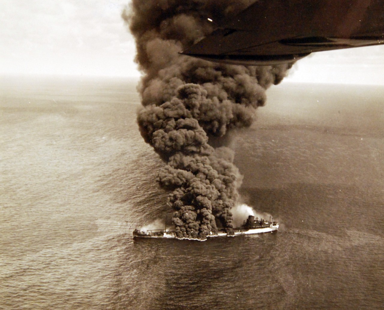 <p>80-G-61597: German U-boat attacks, WWII. SS Pennsylvania Sun burning after being torpedoed amidships by a torpedo by U-571 on July 15, 1942.&nbsp;</p>
