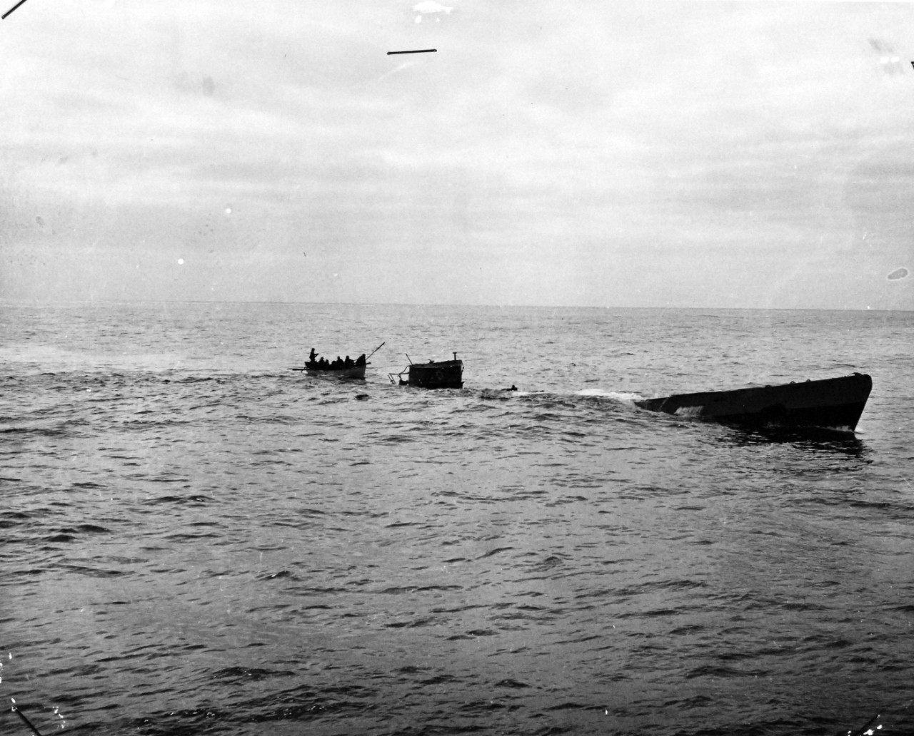 26-G-1514:  Sinking of German submarine U-175, April 1943.   The submarine was sunk off south-west of Ireland by USCGC Spencer (WPG-36) on April 17, 1943.  Original Caption, “COAST GUARD CUTTER SINKS SUB: Coast Guardsmen from the cutter USCGC SPENCER (WPG-36) picking up survivors from the Nazi U-Boat just before it made its final dive.  Meanwhile the convoy steamed on." Date: 17 April 1943   Official U.S. Coast Guard Photograph, now in the collections of the National Archives.  (2017/09/05).