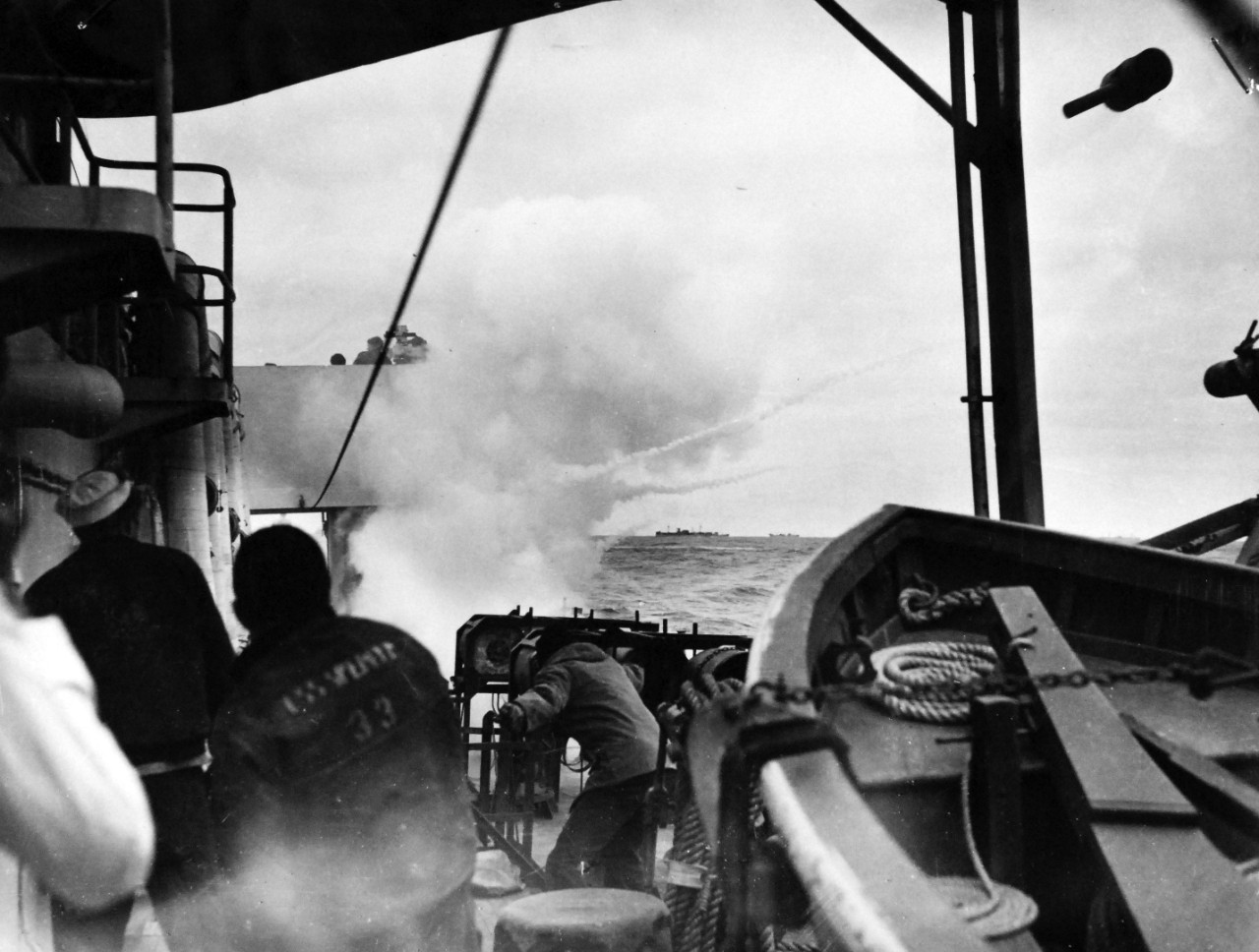 26-G-1515:  Sinking of German submarine U-175, April  1943.   The submarine was sunk off south-west of Ireland by USCGC  Spencer (WPG-36) on April 17, 1943.  Official Caption: "COAST GUARD CUTTER SINKS SUB: Sailors aboard the U.S. Coast Guard Cutter USCGC SPENCER (WPG-36) watch a K-Gun go into action following detection of a submarine below [the] surface. This is the opening round of a battle in which the sub is blown to the surface, where it is engaged by Coast Guardsmen protecting a large Atlantic convoy." Date: 17 April 1943.  Official U.S. Coast Guard Photograph, now in the collections of the National Archives.  (2017/09/05).