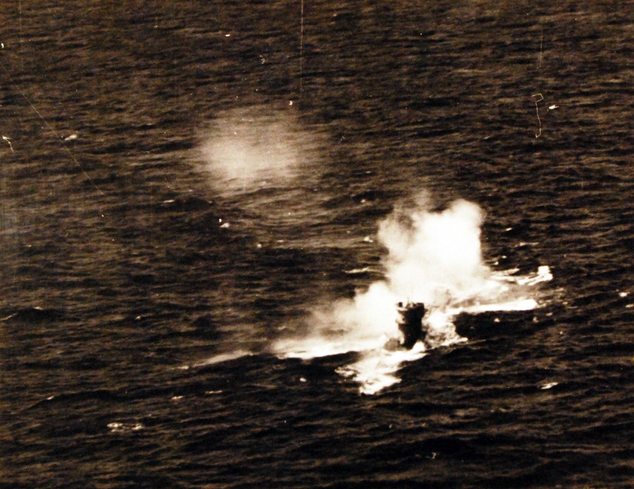 <p>80-G-77193: Air Attacks on German U-boats, WWII.&nbsp; &nbsp;&nbsp;German submarine, U-84, damaged by plane from USS Core (CVE 13), piloted by Ensign William McClane, probably from August 7, 1943.&nbsp;&nbsp; The U-boat was sunk in the North Atlantic, south-west of Bermuda by a Fido homing torpedo fired from a PB4Y “Liberator” aircraft from Bombing Squadron One Hundred Five (VB-105).&nbsp; &nbsp;&nbsp;&nbsp;Incident #4085.&nbsp;&nbsp;&nbsp;&nbsp;&nbsp; Released August 23, 1943.&nbsp; &nbsp;</p>
