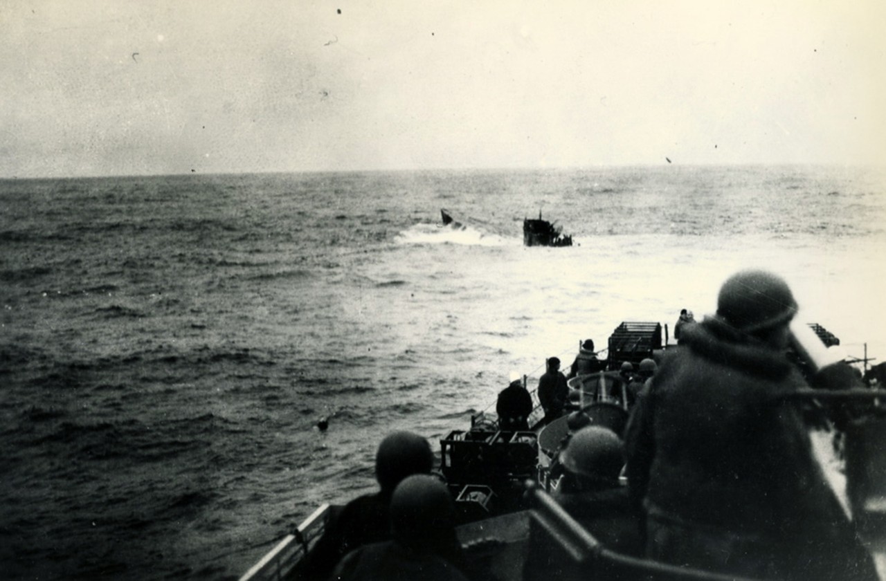 26-G-2552:   Sinking of German U-boats, 1944.    German (Type IXC) U-boat, U-550, surfaces astern of USS Joyce (DE 317) after being depth charged, April 16, 1944.  Joyce had a Coast Guard crew.  U.S. Coast Guard photograph now in the collections of the National Archives. 
