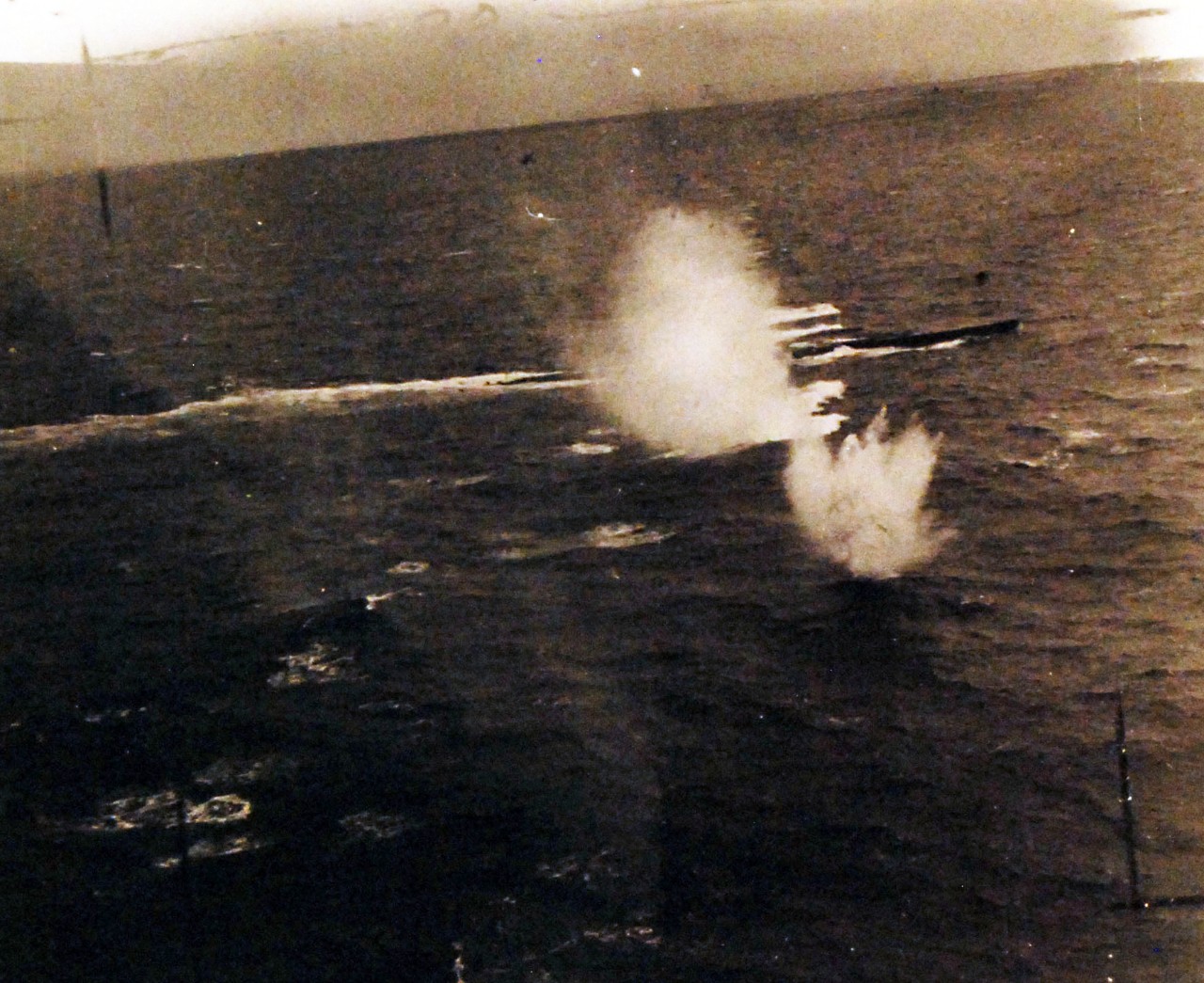 <p>80-G-49783:&nbsp; Air Attack on German U-boats, WWII.&nbsp;&nbsp; Attack on German submarine, U-550,&nbsp; by U.S. Navy and Army planes in the Atlantic, November 1943.&nbsp;&nbsp; A moment after bombs are released swirls where they entered water can be seen. &nbsp;U-505 would later be rammed depth charged and shelled by USS Gandy (DE 764), USS Joyce (DE 317), and USS Peterson (DE 152), the German submarine U-550 was sunk on April 16, 1944.&nbsp;&nbsp; Released July 2, 1945.&nbsp; &nbsp;</p>
