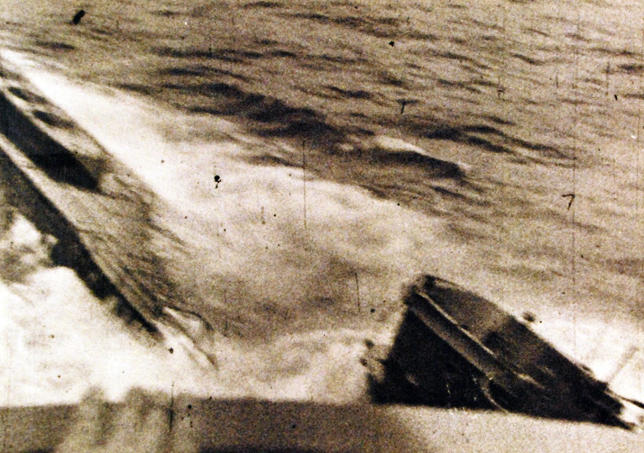 <p>80-G-700005: Battle of the Atlantic. U-233 (German Type XB Submarine) is rammed by USS Thomas (DE 102), 5 July 1944 in the North Atlantic. Photographed from Thomas as she struck the submarine amidships. Note mine shuts on U-233’s foredeck, a feature of the type of XB U-Boats.&nbsp;</p>
