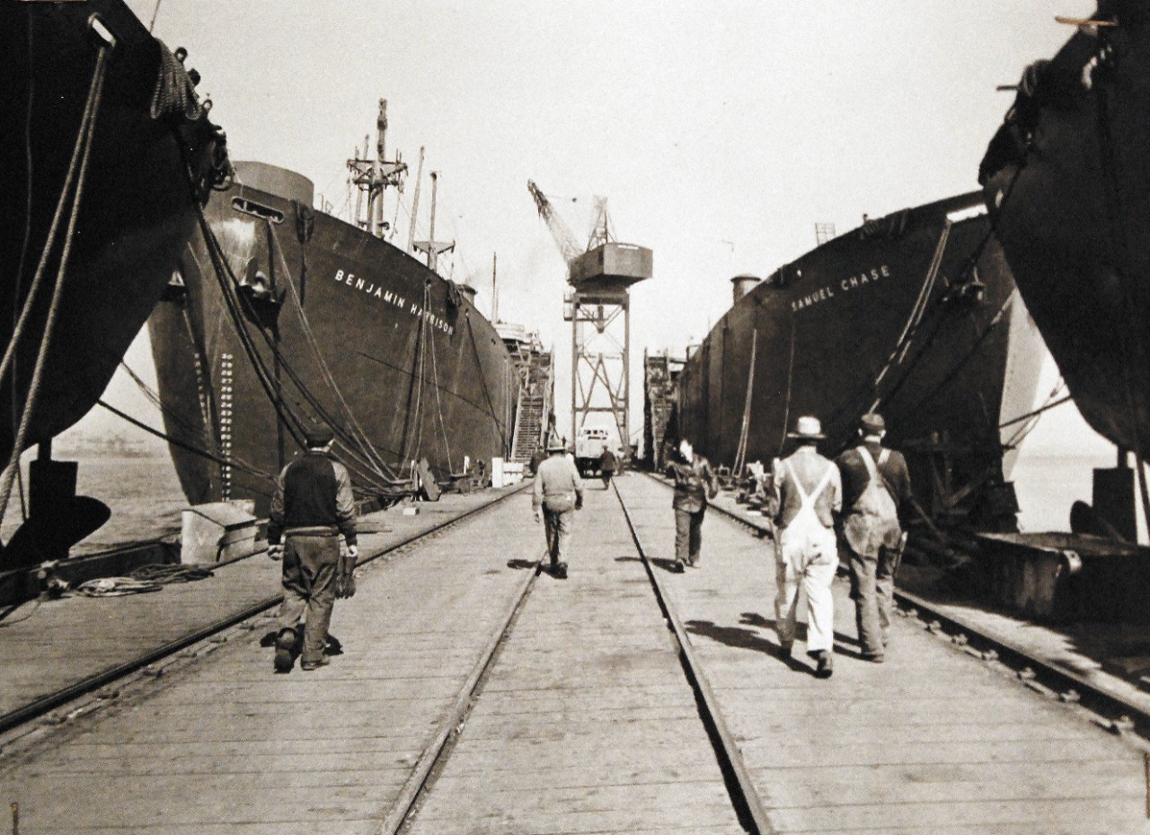 <p>Lot-9434-11: American Shipyards Reach All-Time High In Production. Shown: Liberty Ships, shown SS Benjamin Harrison and SS Samuel Chase, at Bethlehem Yard are being fitted to prepare them for joining the fleet of Allied ships now on the seas. Note, Benjamin Harrison was torpedoed by U-172 on March 4, 1943. She was scuttled on March 16th. Office of War Information Photograph, April 22-28, 1942. (2016/01/08).</p>
