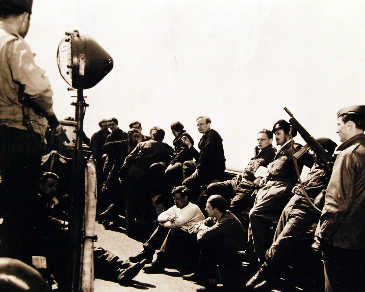 <p>80-G-700487: Surrender of German U-Boats, 1945Officers and men of German submarine, U-858, on a U.S. tug while being taken to Fort Miles on the Delaware Bay, May 1945. Their ship, which surrendered in the mid-Atlantic, was officially turned over to the Fourth Naval District. Photograph released May 10, 1945.&nbsp;</p>
