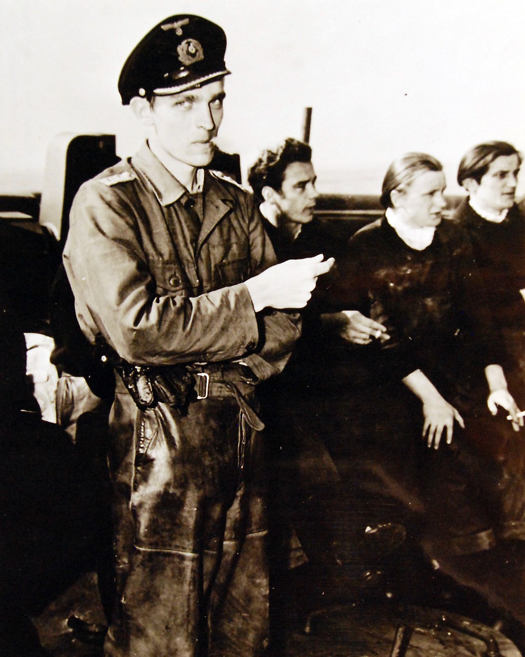 <p>80-G-700489: Surrender of German U-Boats, 1945. Lieutenant Thilo Bode, Captain of the German submarine, U-858, aboard the tug which met the U boat and her escorts off Cape May, New Jersey, May 1945. Photograph released May 10, 1945.&nbsp;</p>
