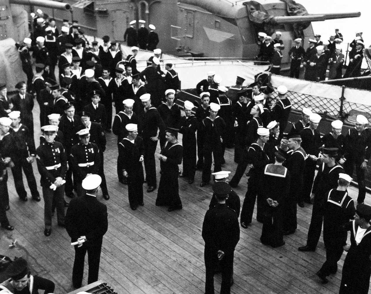 80-G-26849: Atlantic Charter, August 1941.  President Franklin D. Roosevelt and Prime Minister Winston S. Churchill and high-ranking naval and military men of both nations at divine services onboard Royal Navy battleship HMS Prince of Wales during the Atlantic Charter.  They are shown mingling on deck.   Photograph released August 10, 1941.   Official U.S. Navy Photograph, now in the collections of the National Archives.  (2016/03/22).