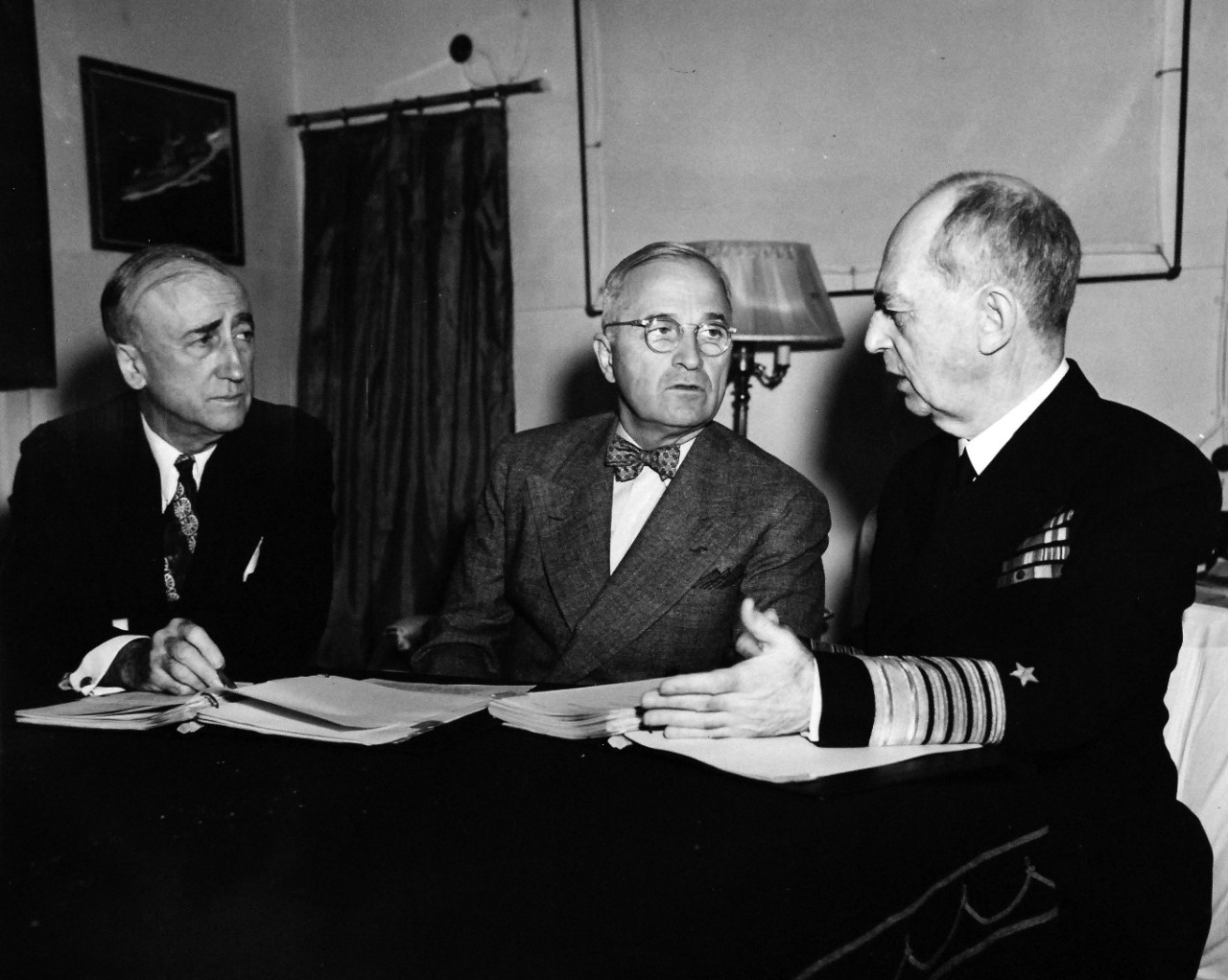 80-G-49927:  Potsdam Conference,  July-August 1945.  President Harry S. Truman onboard USS Augusta (CA-31) en-route to Antwerp for the “Big Three” Conference.  Shown:  (left to right) Secretary of State James F. Byrnes, President Truman, and Admiral William D. Leahy, USN, in Mr. Byrnes cabin.   Photograph received July 18, 1945.  Official U.S. Navy Photograph, now in the collections of the National Archives.  (2016/02/23).