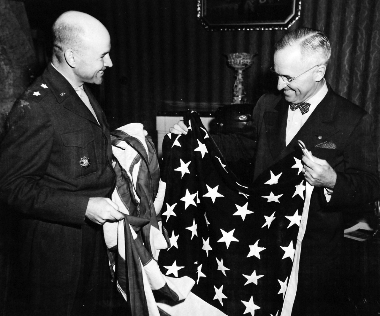 80-G-700073:  U.S. Navy in Germany, 1945.   Major General Floyd L. Parks, USA, CO of U.S. Headquarters Berlin presents 1st American Flag to fly over Berlin, Germany, to President Harry S. Truman at the “Little White House” at Postdam, Germany, July 23, 1945.   Official U.S. Navy photograph, now in the collections of the National Archives.  (2017/02/14).  