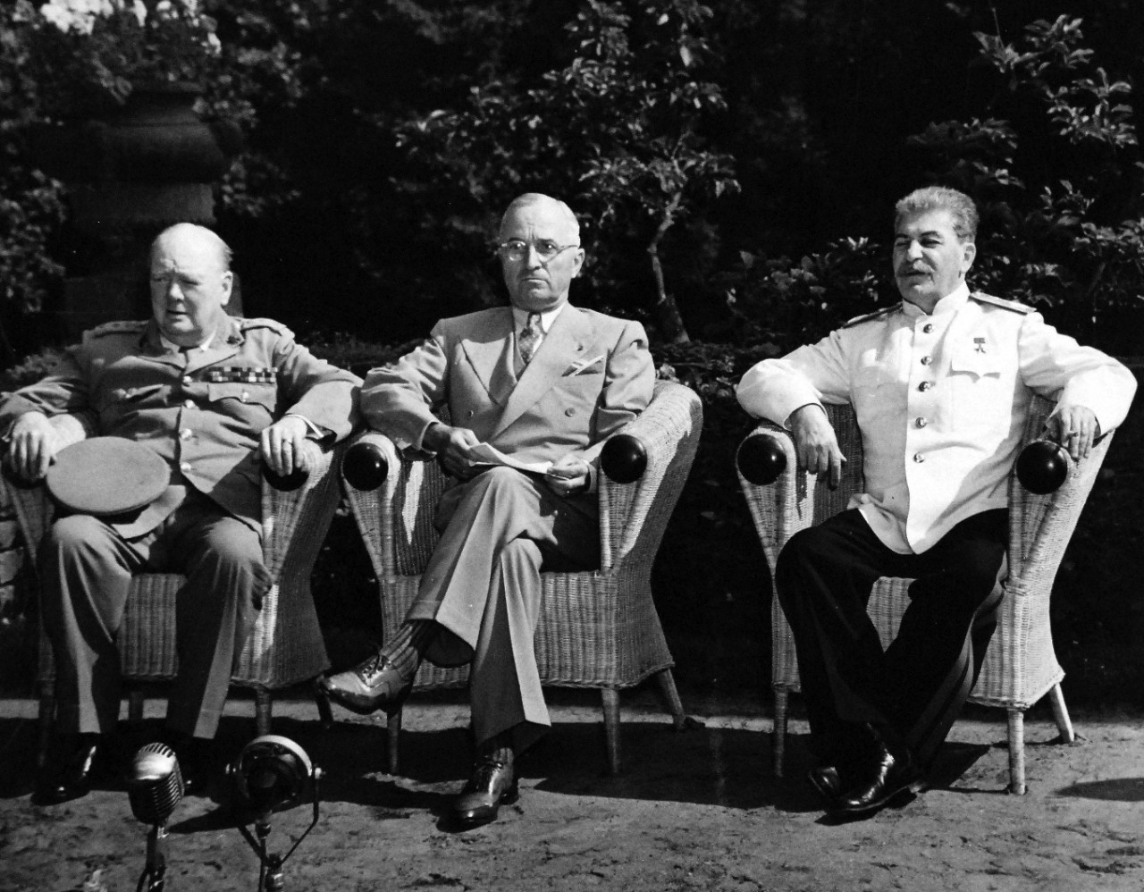 80-G-700110: Potsdam Conference, July-August 1945.  The “Big Three” at Potsdam, Germany, pose for a formal photograph in garden near the meeting palace.  Left to right:  Prime Minister Winston S. Churchill; President Harry S. Truman, and Premier Joseph Stalin.  Photographed released July 25, 1945.  Official U.S. Navy Photograph, now in the collections of the National Archives.  (2016/02/23).
