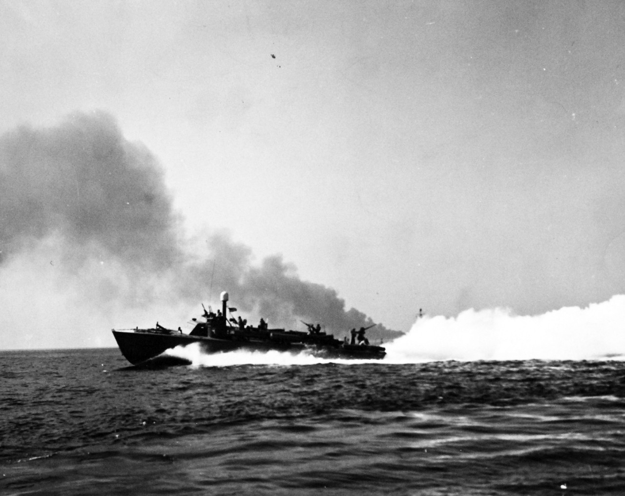 80-G-87326:  Operation Avalanche, September 1943.  PT Boat laying smoke screen around USS Ancon (AGC-4) in the Gulf of Salerno, Italy.  Photograph released September 12, 1943.   U.S. Navy photograph, now in the collections of the National Archives.  (2017/04/04).