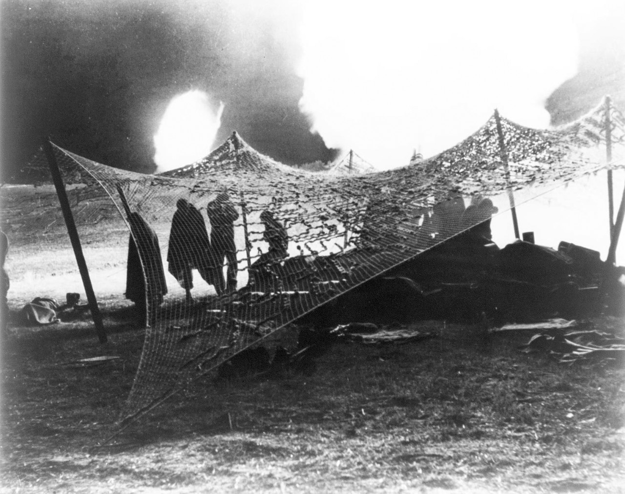 LC-USZ62-80639:   Operation Husky – Invasion of Sicily, 9 July – August 17, 1943.   “The War Does Not Stop For Darkness.”    Outside Cerami, Sicily, American 155 m.m. Howitzers throw shells at retreating Italian and German Soldiers.  Note soldiers under netting.  U.S. Army Photograph (2015/11/13).